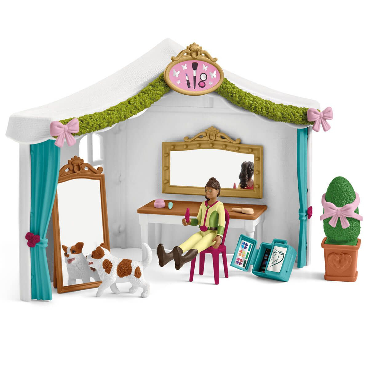 Eine Spielzeugszene mit Zelt, Spiegeln, einem Hund und einem Mädchen mit Make-up. Eine Schminkszene.