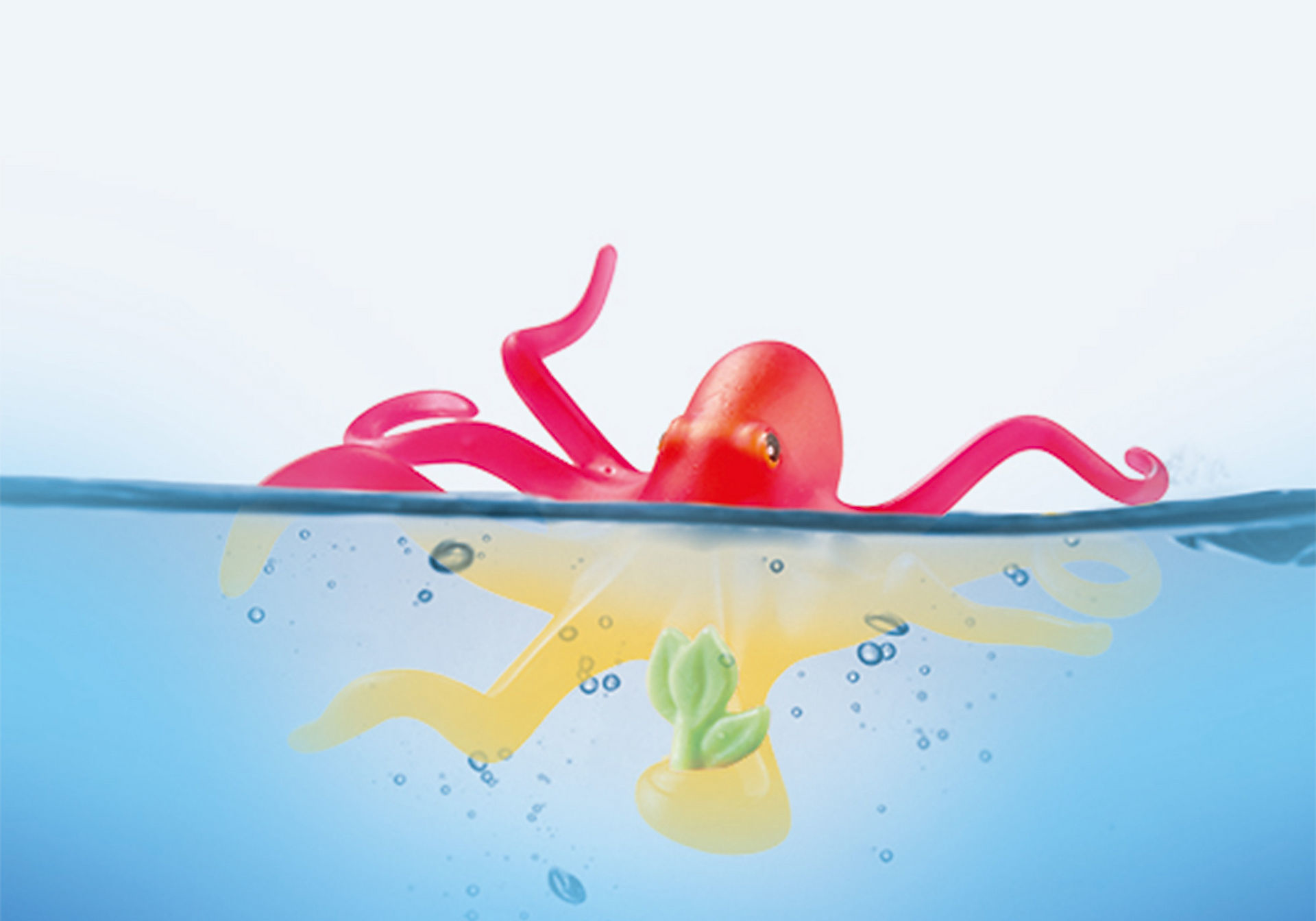 Roter Oktopus mit gelben Tentakeln, der im Wasser schwebt.