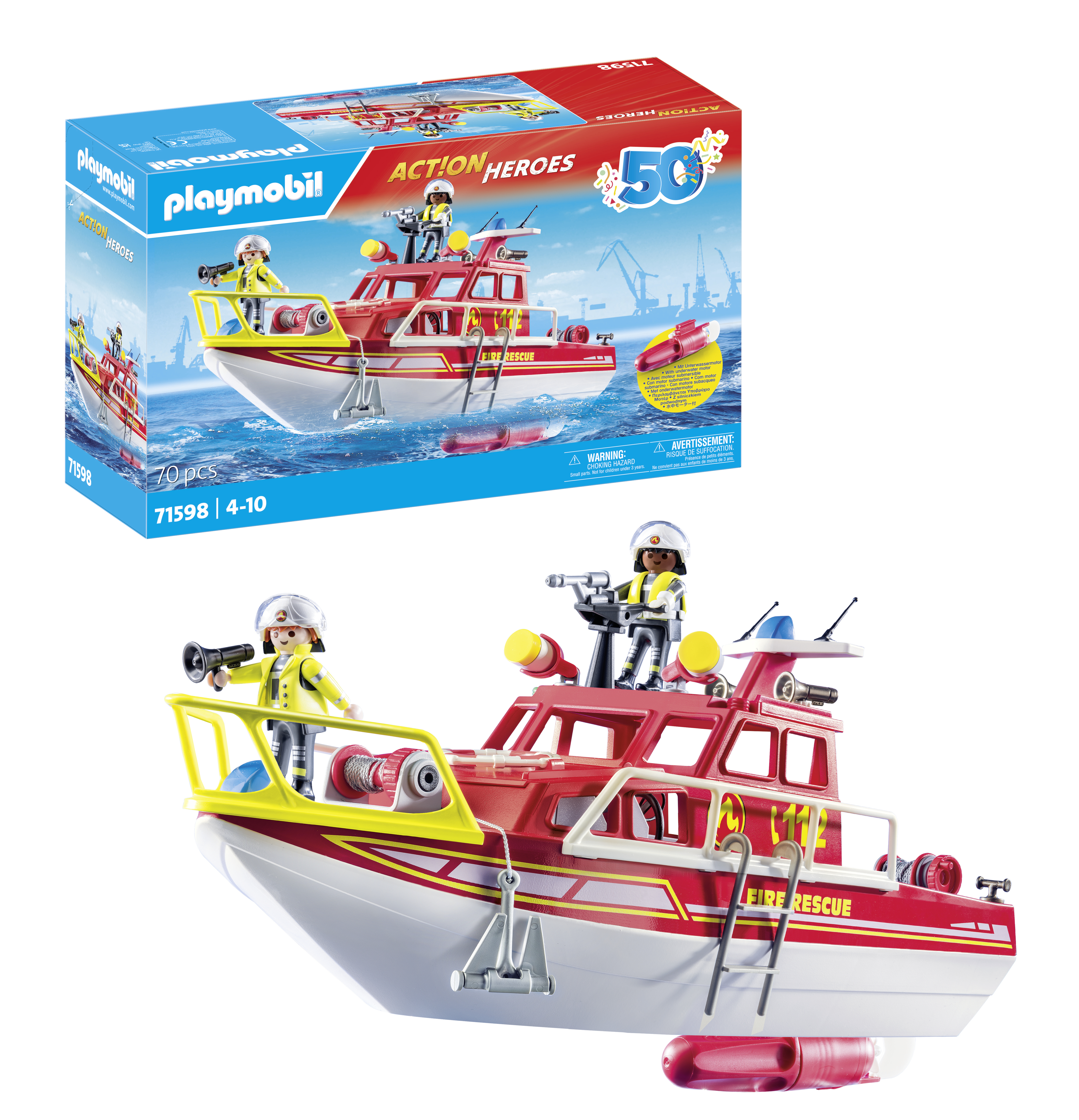 Ein rotes und weißes Spielzeugboot mit Figuren und die Spielzeugkiste im Hintergrund.