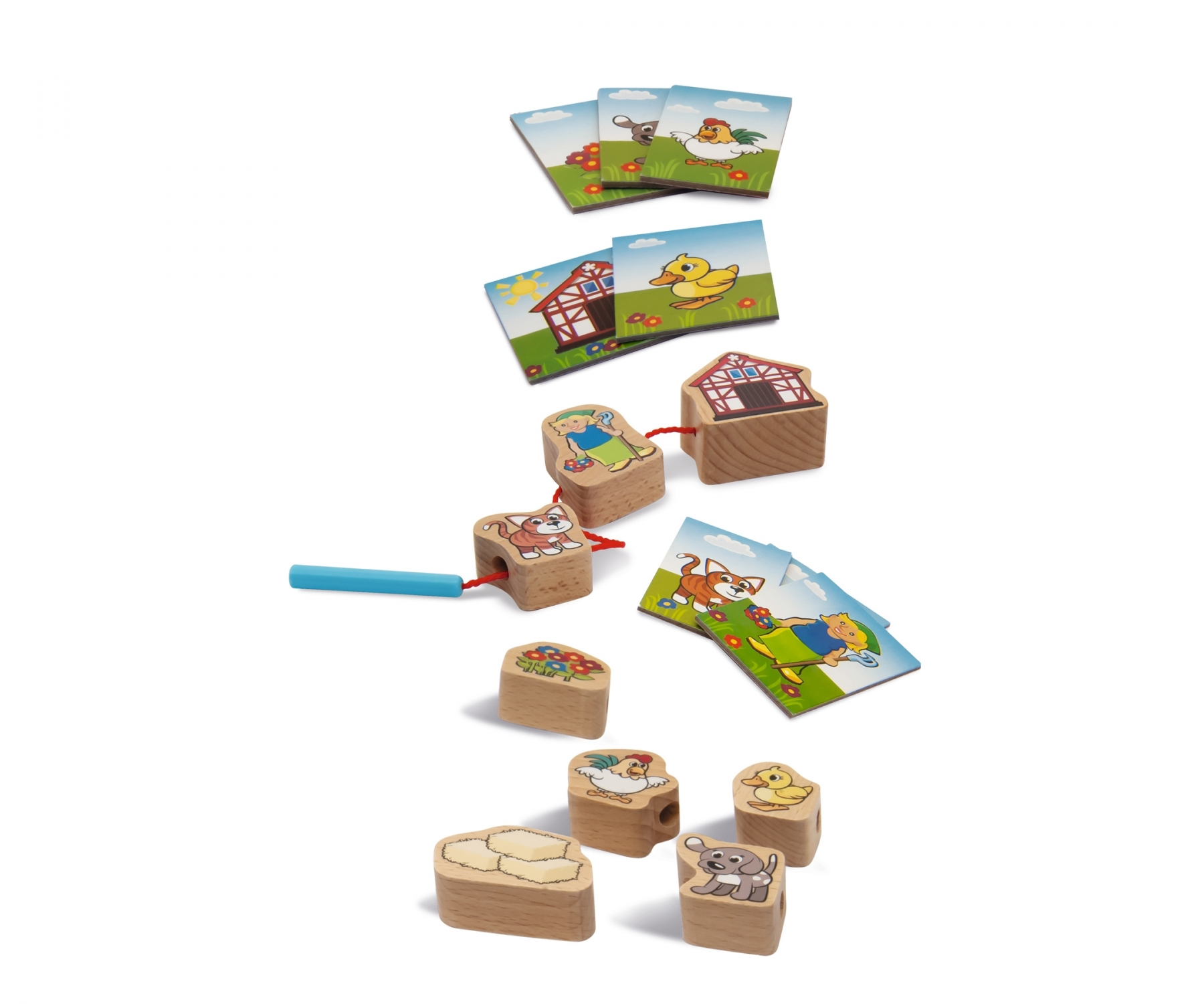 Holzspielzeug mit Karten und Holzfiguren von Tieren und Häusern.