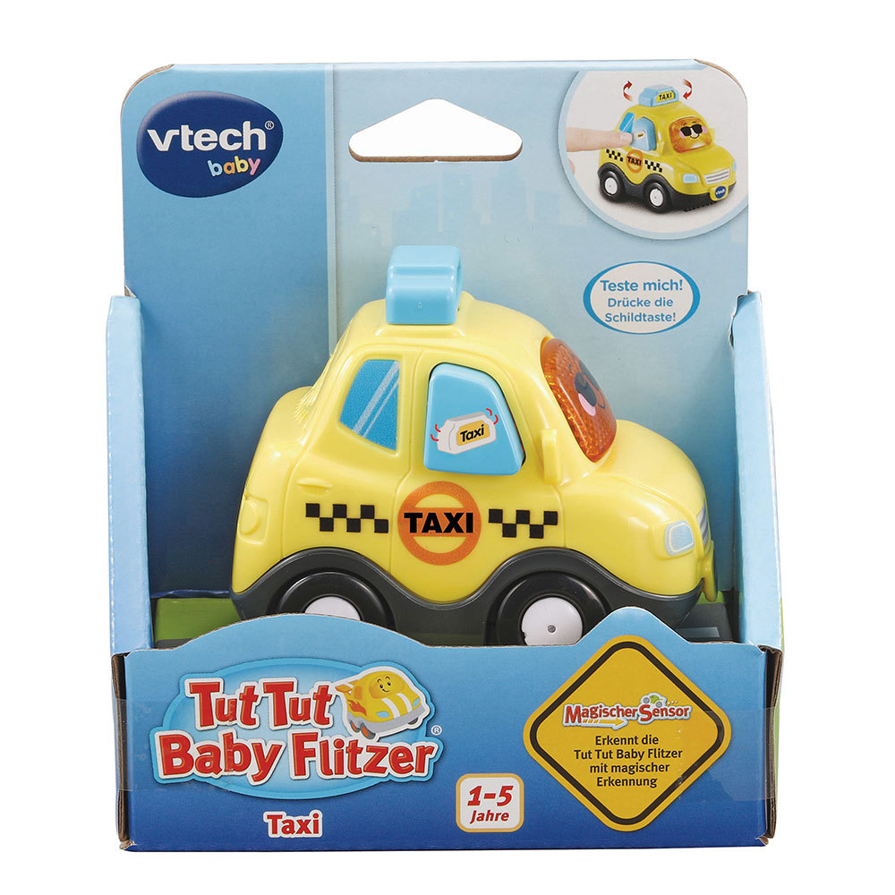 Ein gelbes Spielzeugtaxi befindet sich in der Originalverpackung. Es hat ein blaues Dach und schwarze Taxikennzeichen.