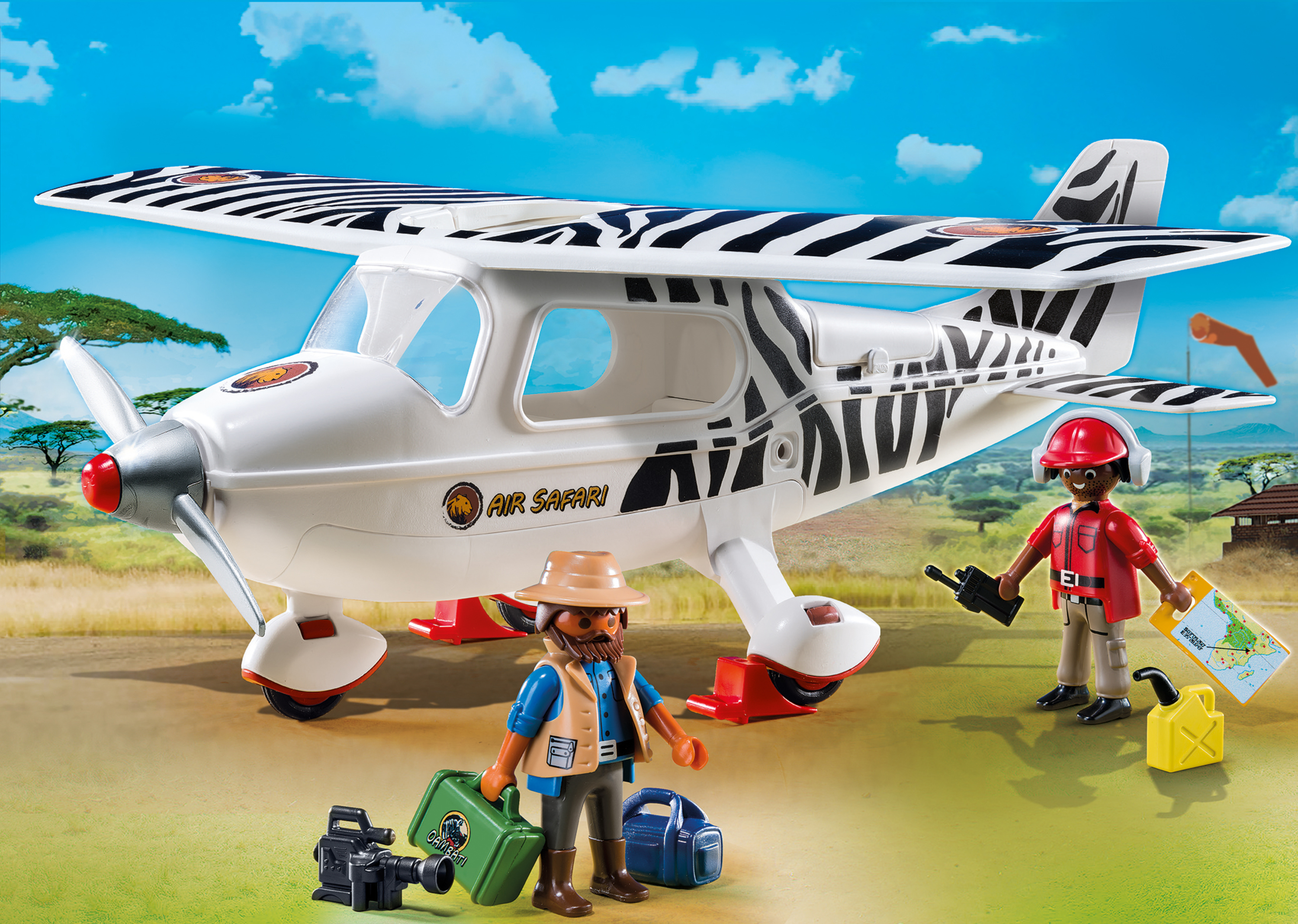 Ein Spielzeugflugzeug mit Zebrastreifen, zwei Figuren und einem Landschaftshintergrund.