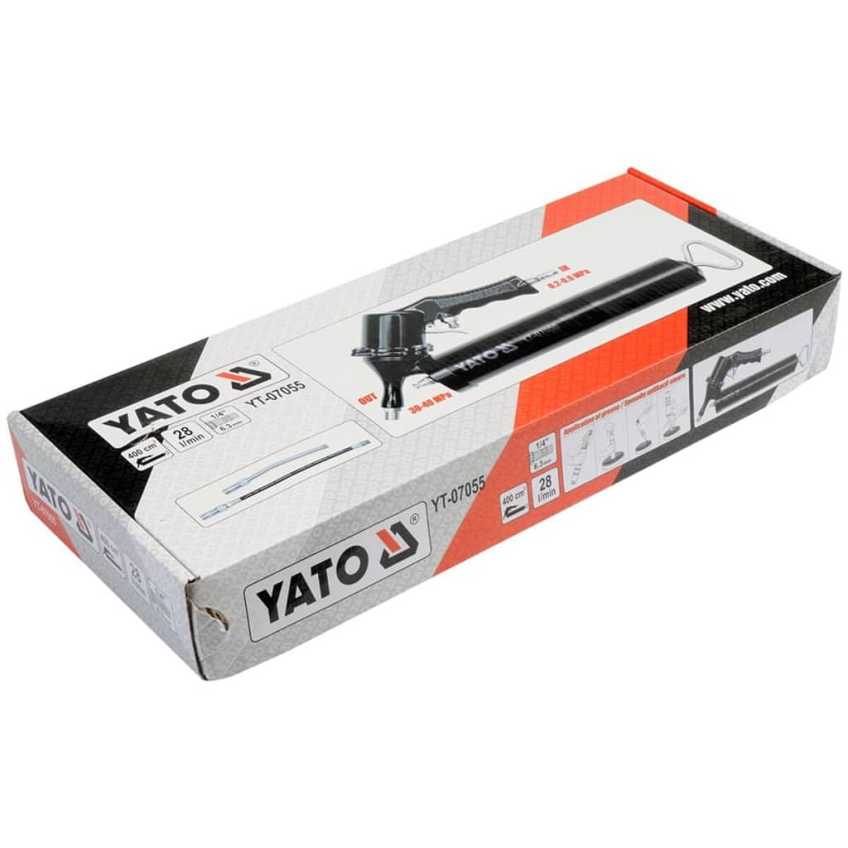 Una scatola YATO con una pistola ingrassatrice e i suoi componenti, con etichette, su sfondo bianco.