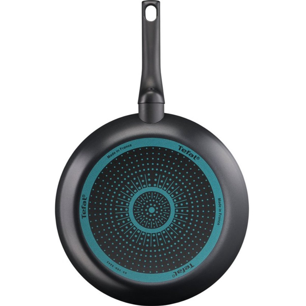Poêle Tefal noire avec base intérieure à pois bleu turquoise et manche noir.