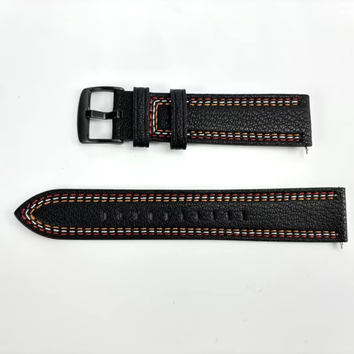 Ein schwarzes Leder-Uhrenarmband mit orangefarbenen und gelben Nähten. Es hat eine schwarze Schnalle und ist unbefestigt.