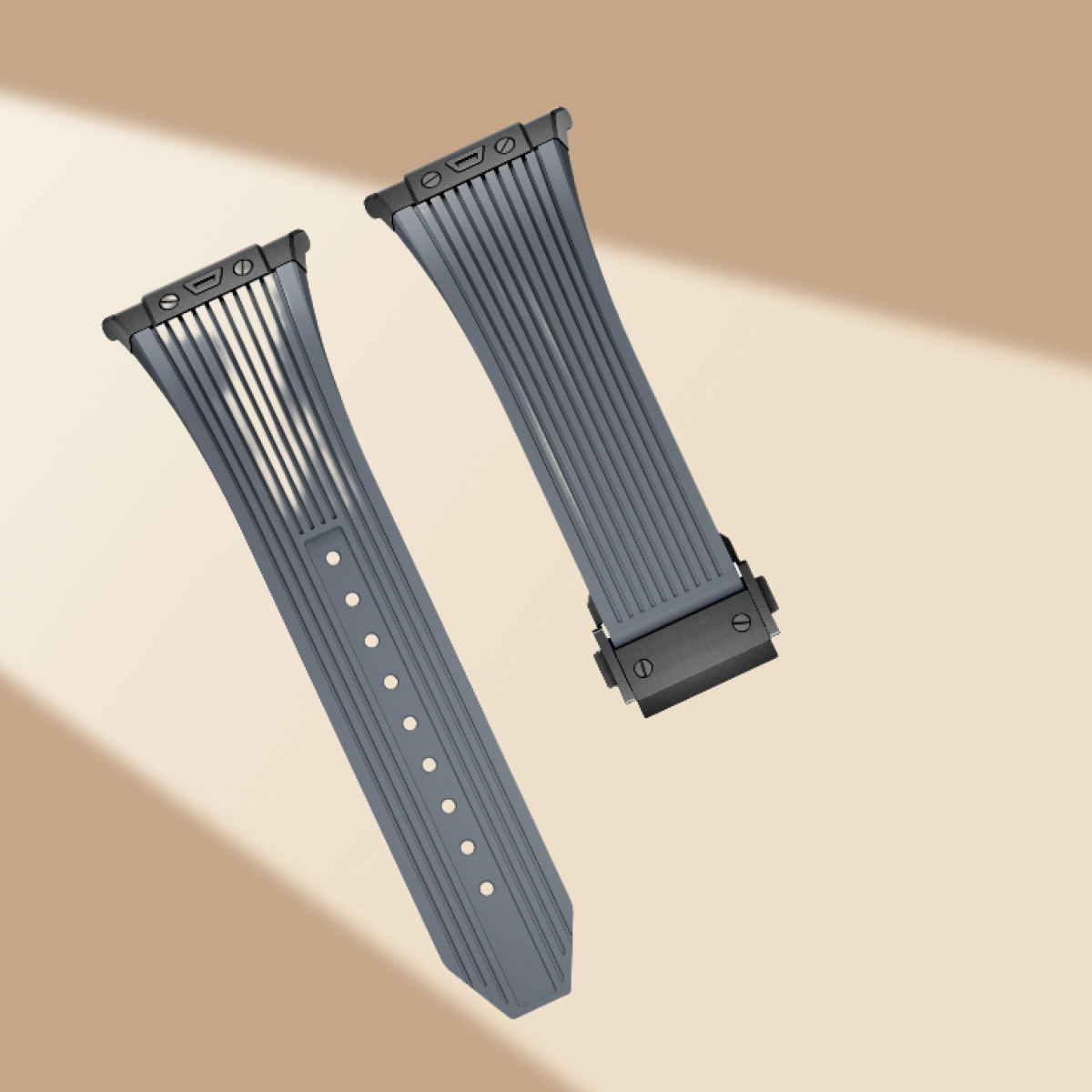 Due cinturini grigi con attacchi neri. I cinturini hanno un design a coste e sono mostrati in primo piano.