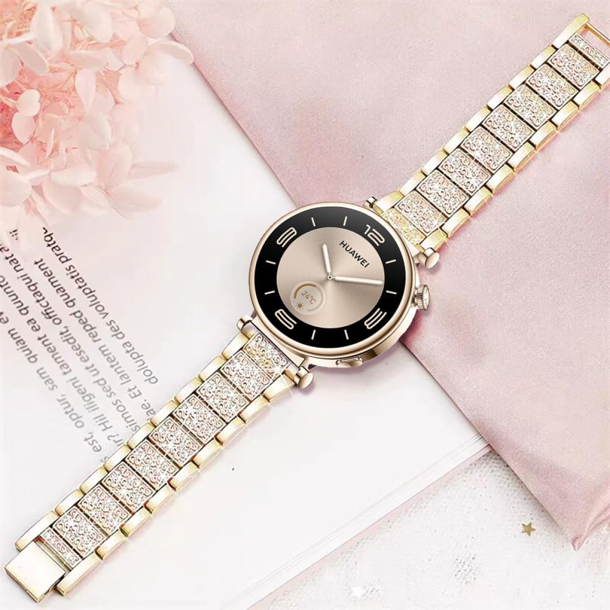 Smartwatch dorato con cinturino scintillante, posto su rosa, con testo.