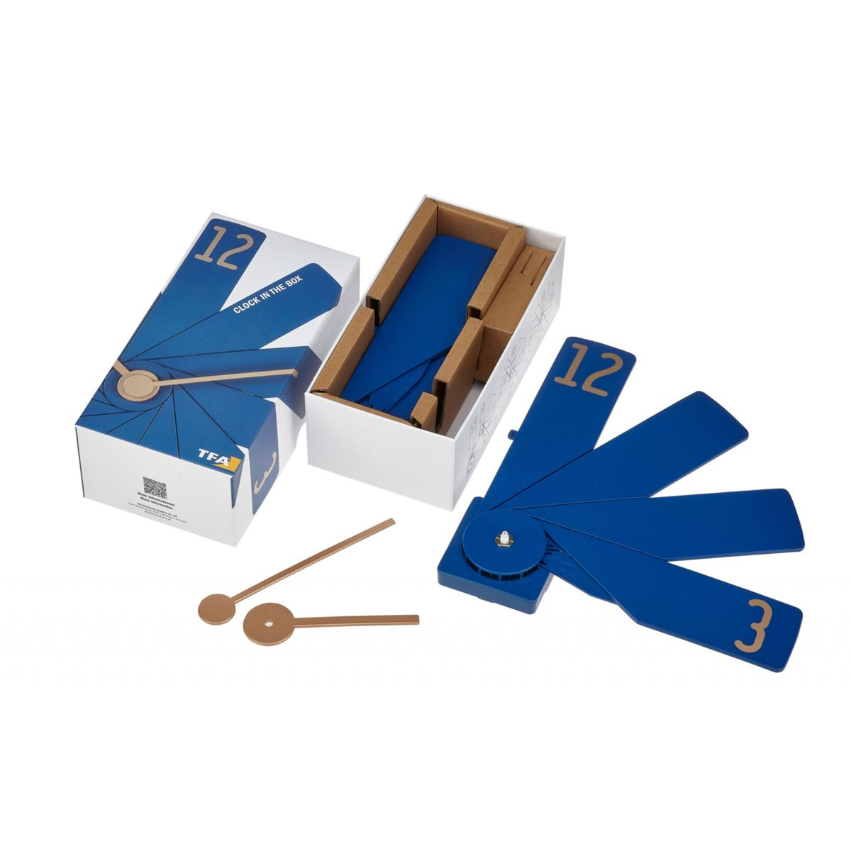 Uhrteile in einer Box: zwei Zeiger, blau nummeriertes Zifferblatt und eine weiße Box.