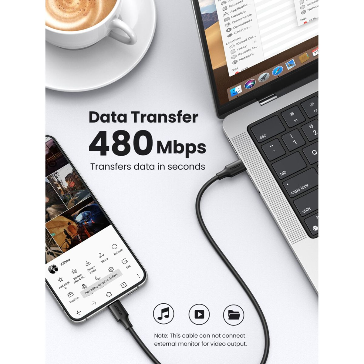 Telefon podłączony do laptopa za pomocą czarnego kabla. Pokazano transfer danych 480 Mb/s.