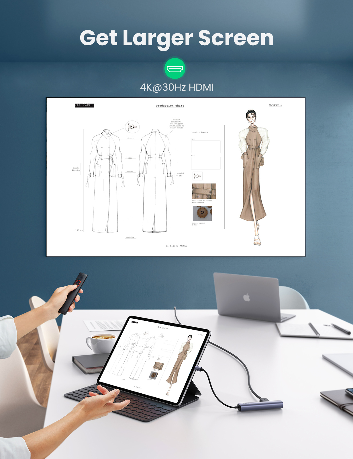 Person präsentiert Designs auf einem Bildschirm, der mit Tablet und Laptop verbunden ist, mit Steuerung.