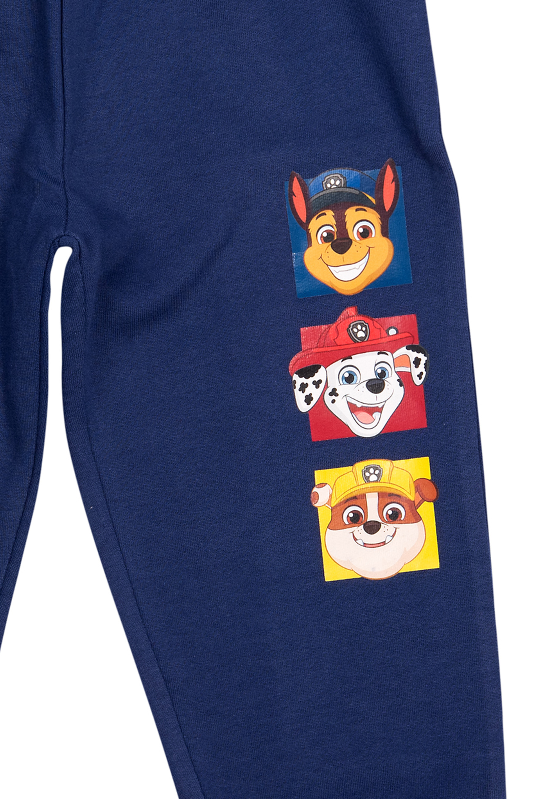 Marineblaue Jogginghose mit Paw Patrol-Charakteren auf dem Bein. Chase, Marshall und Rubble.