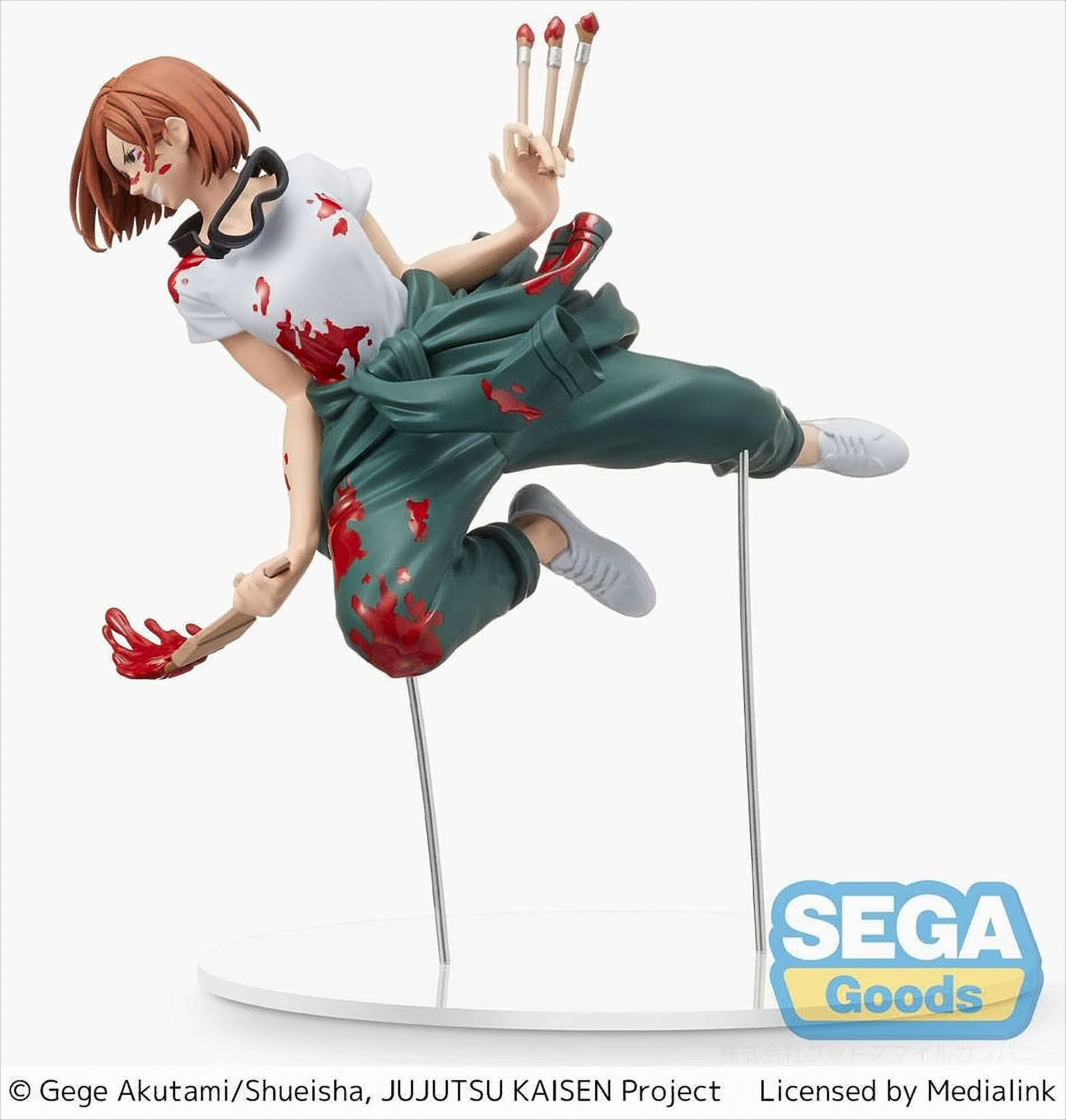 Anime-Figur einer Frau in grüner Hose und weißem Oberteil. Sie hält Pinsel.