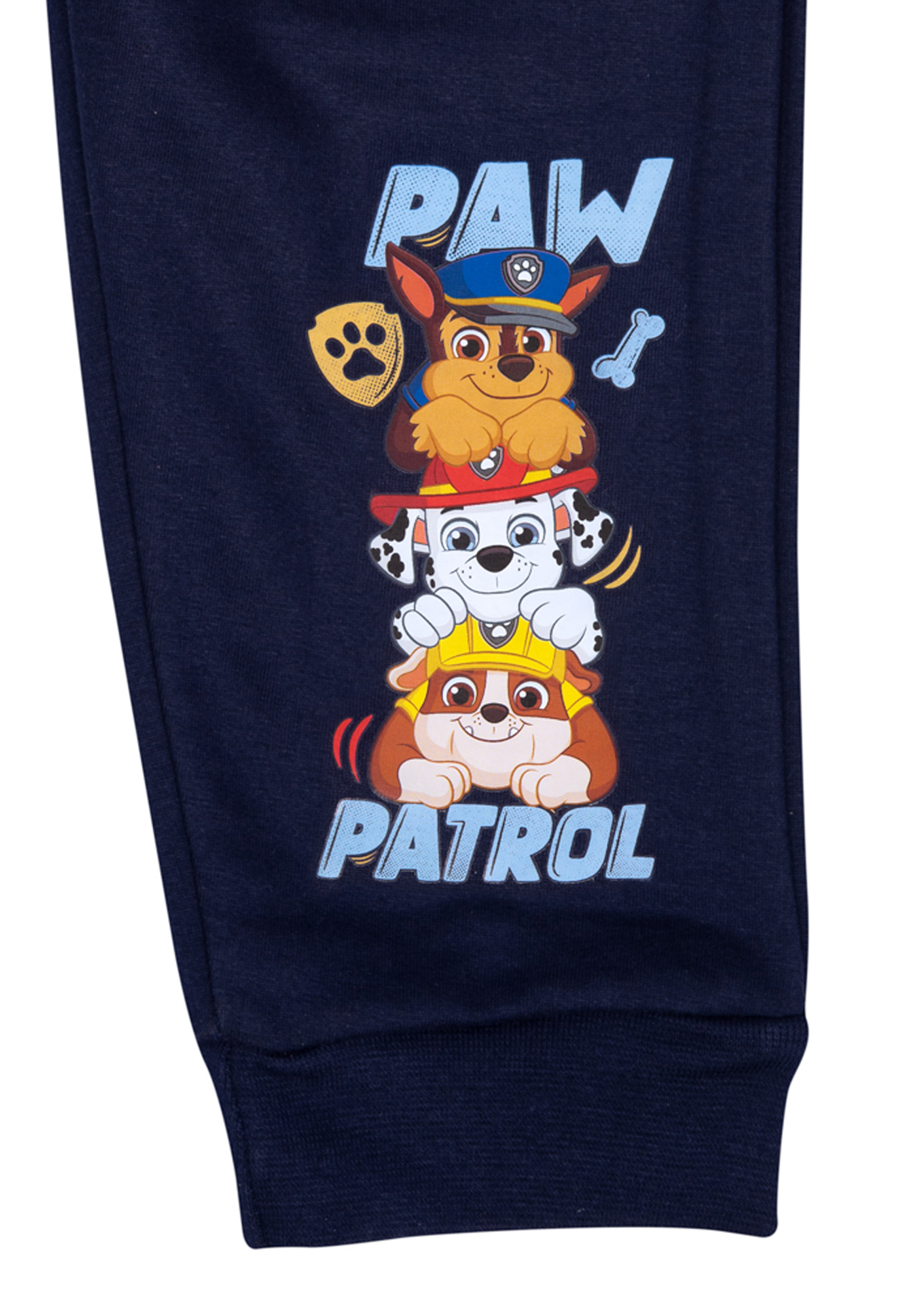 Marineblaue Hose mit Paw Patrol Grafik von übereinander gestapelten Welpen.
