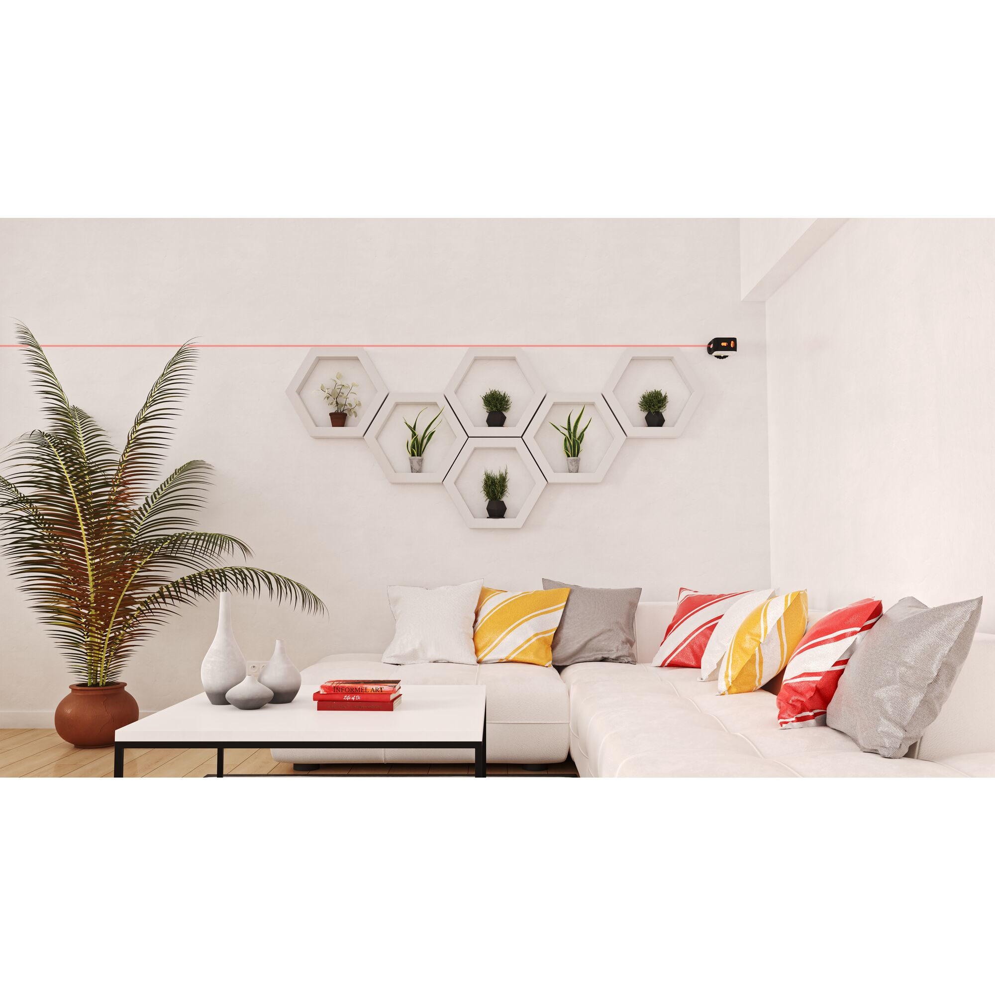 Salón con nivel láser, sofá y adornos. Línea láser roja, objetos blancos y coloridos.