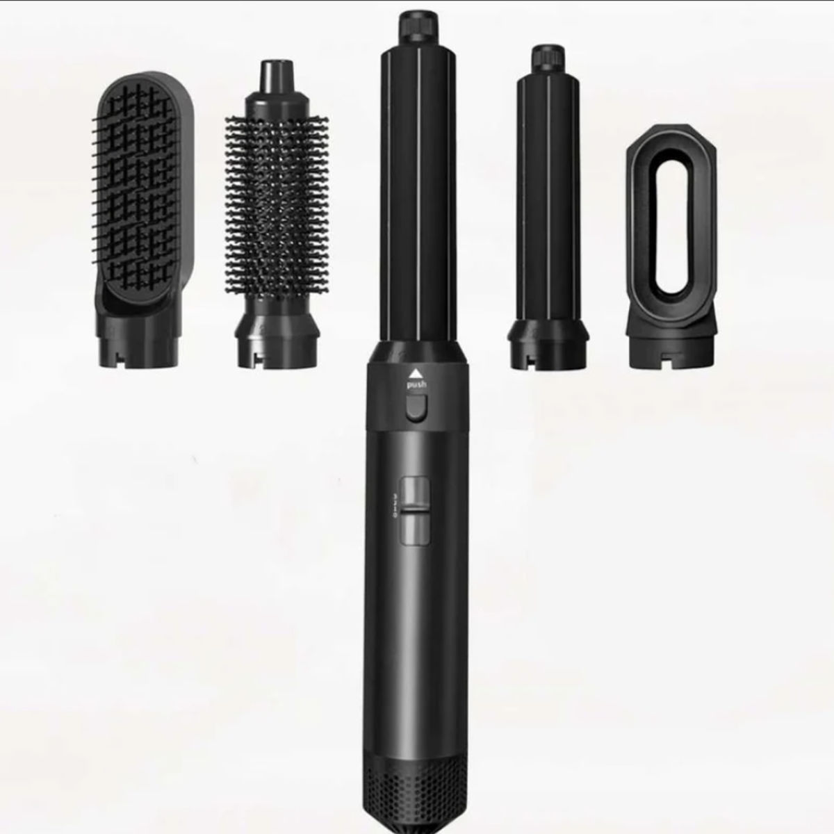 Ein schwarzer Haarstyler mit fünf Aufsätzen.