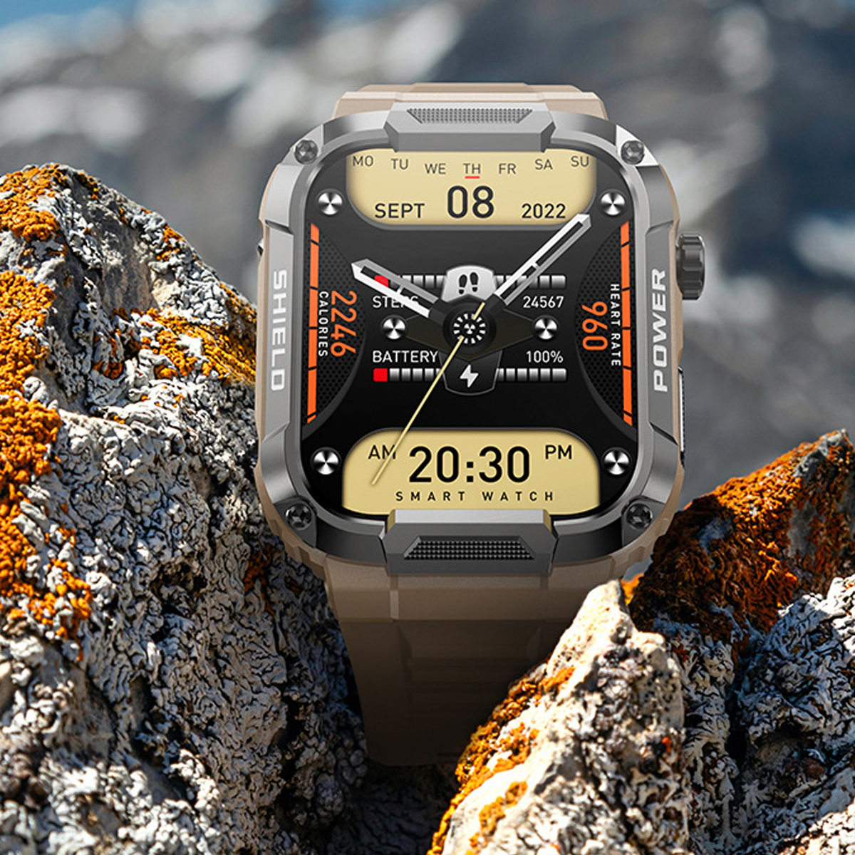 Robuste Smartwatch auf Felsen, zeigt Zeit, Akku, Herzfrequenz und verbrannte Kalorien.
