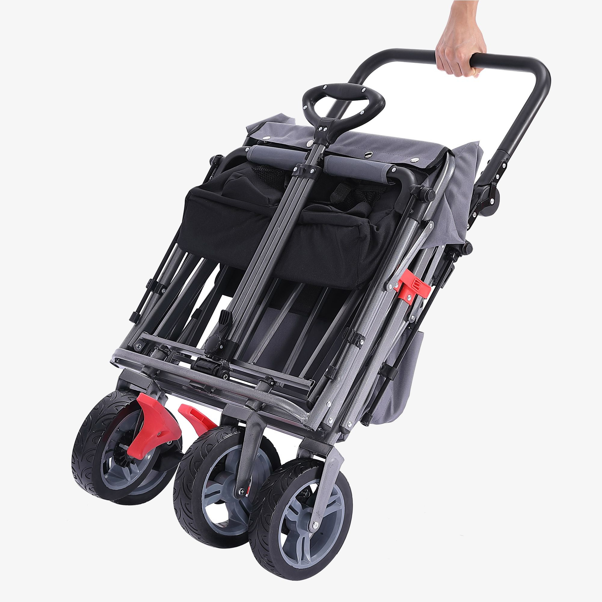 Grauer und schwarzer Wagen mit grauen Rädern. Eine Hand hält den Griff. Rückansicht.