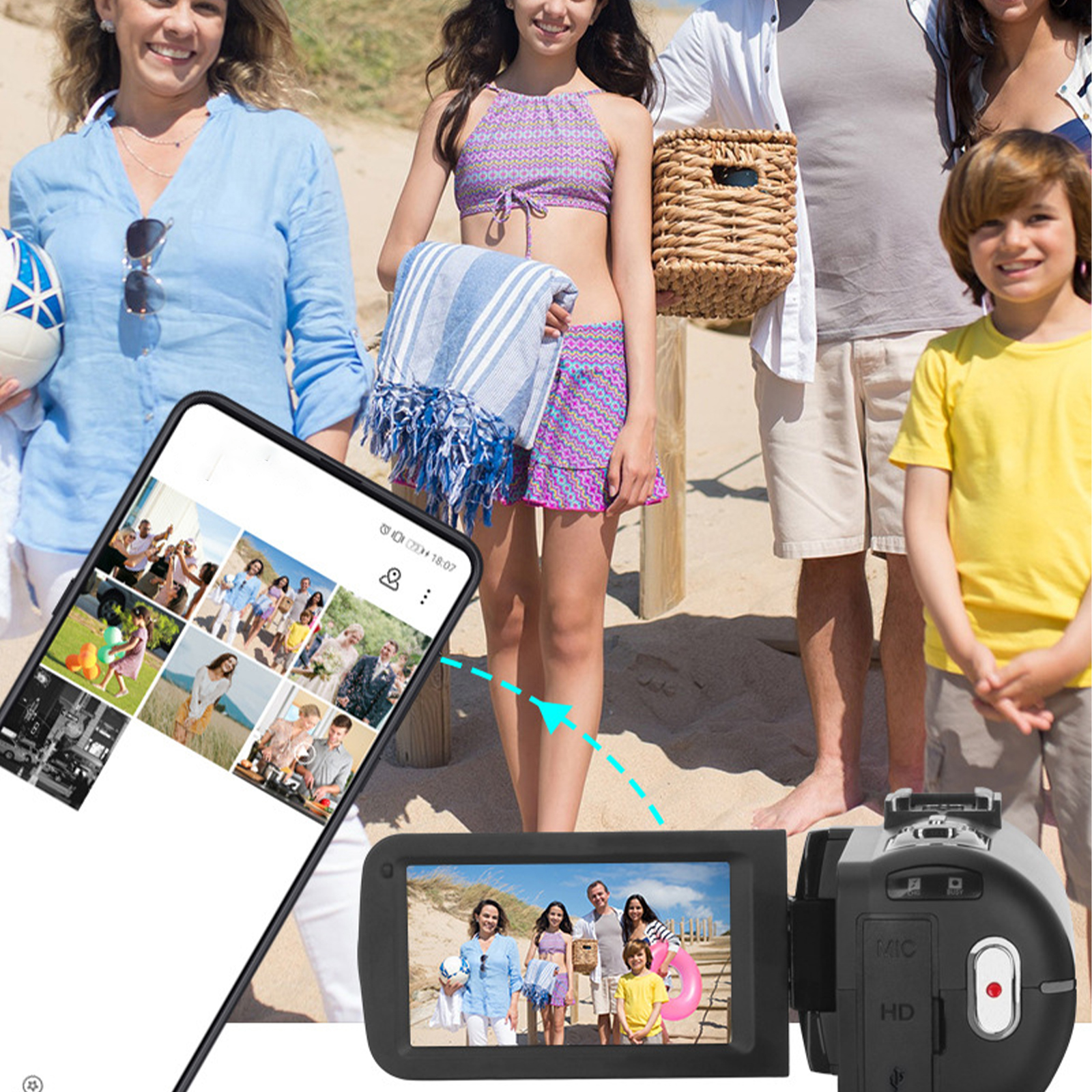 Familie am Strand, mit Videokamera und Telefon, das Bilder zeigt.
