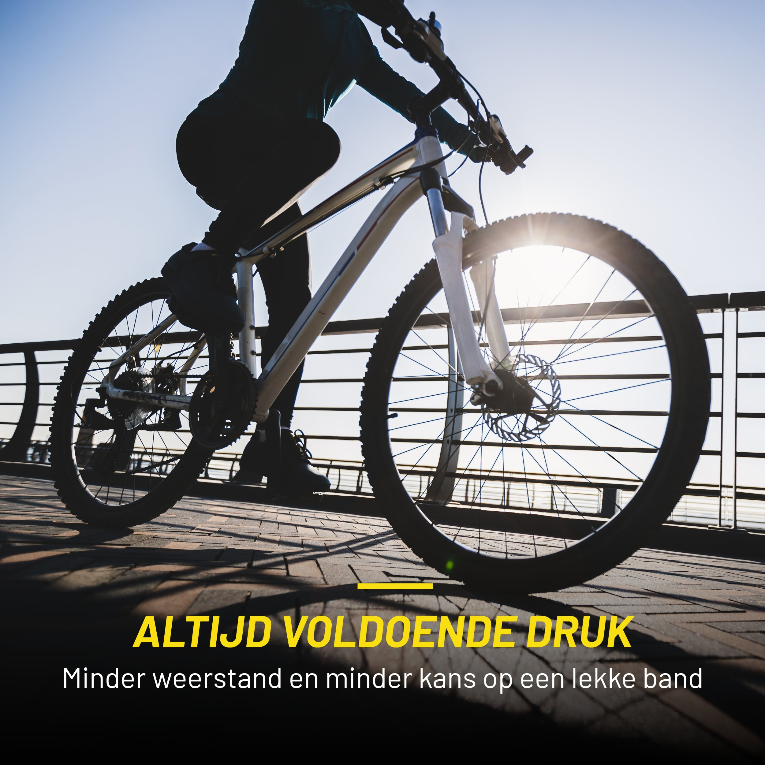 Person biking on a bridge. Text: ALWAYS SUFFICIENT PRESSURE, less resistance.