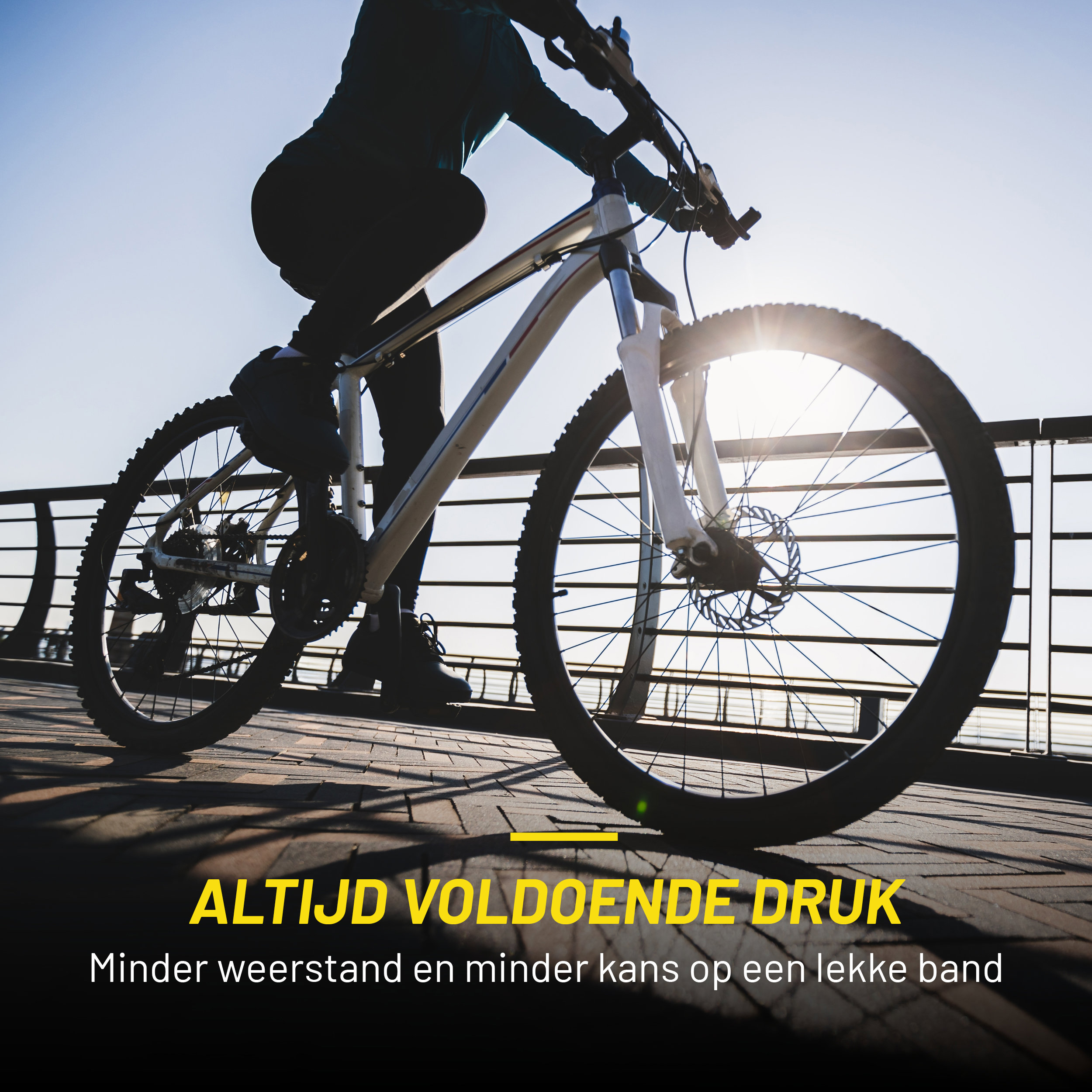 A person is riding a bike on a bridge. Sun in background. Text: Always enough pressure.