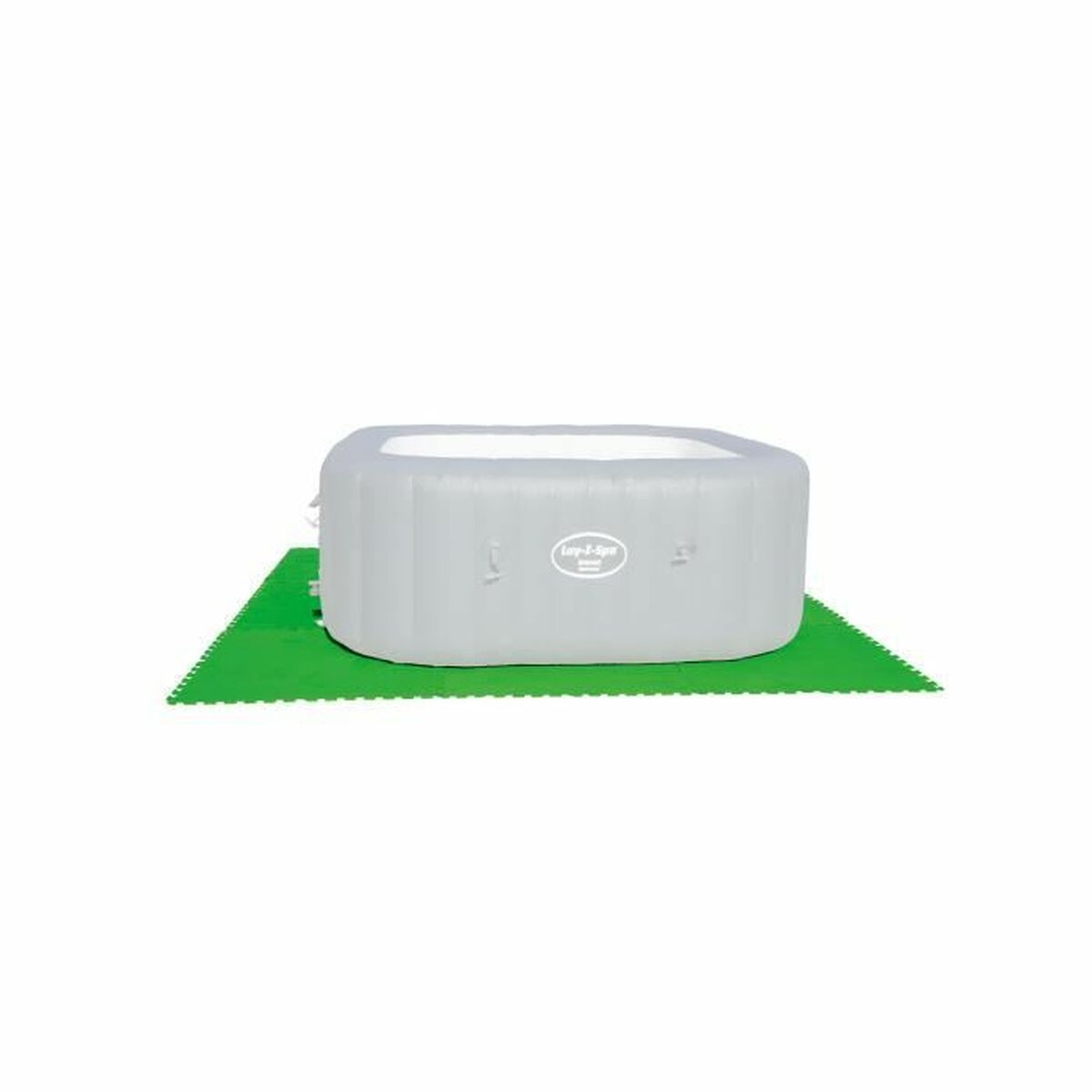 Una bañera de hidromasaje inflable gris sobre tapetes de espuma verde entrelazados.