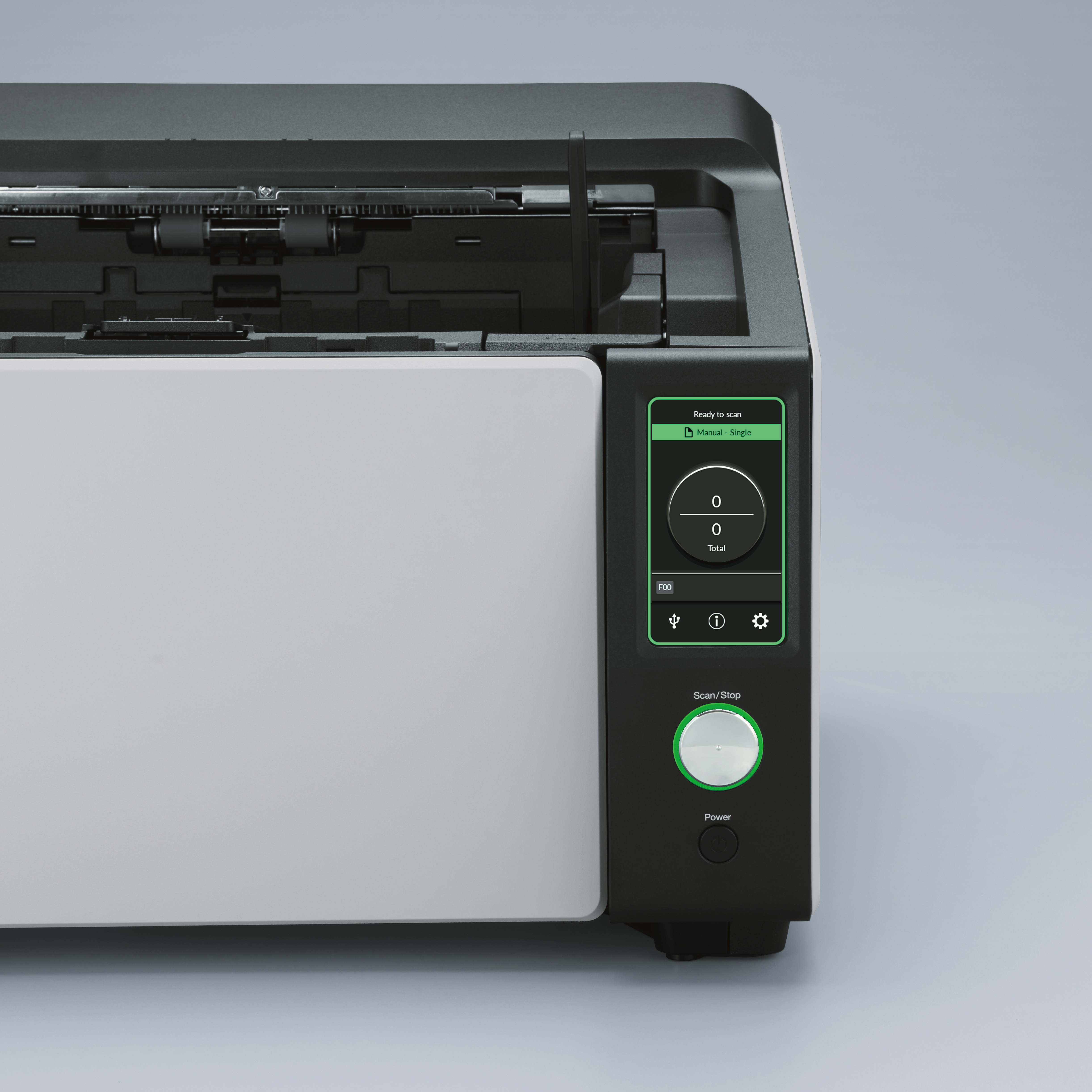 Een close-up van een zwart-witte scanner. Hij heeft een groene 'Scan/Stop'-knop en een display.