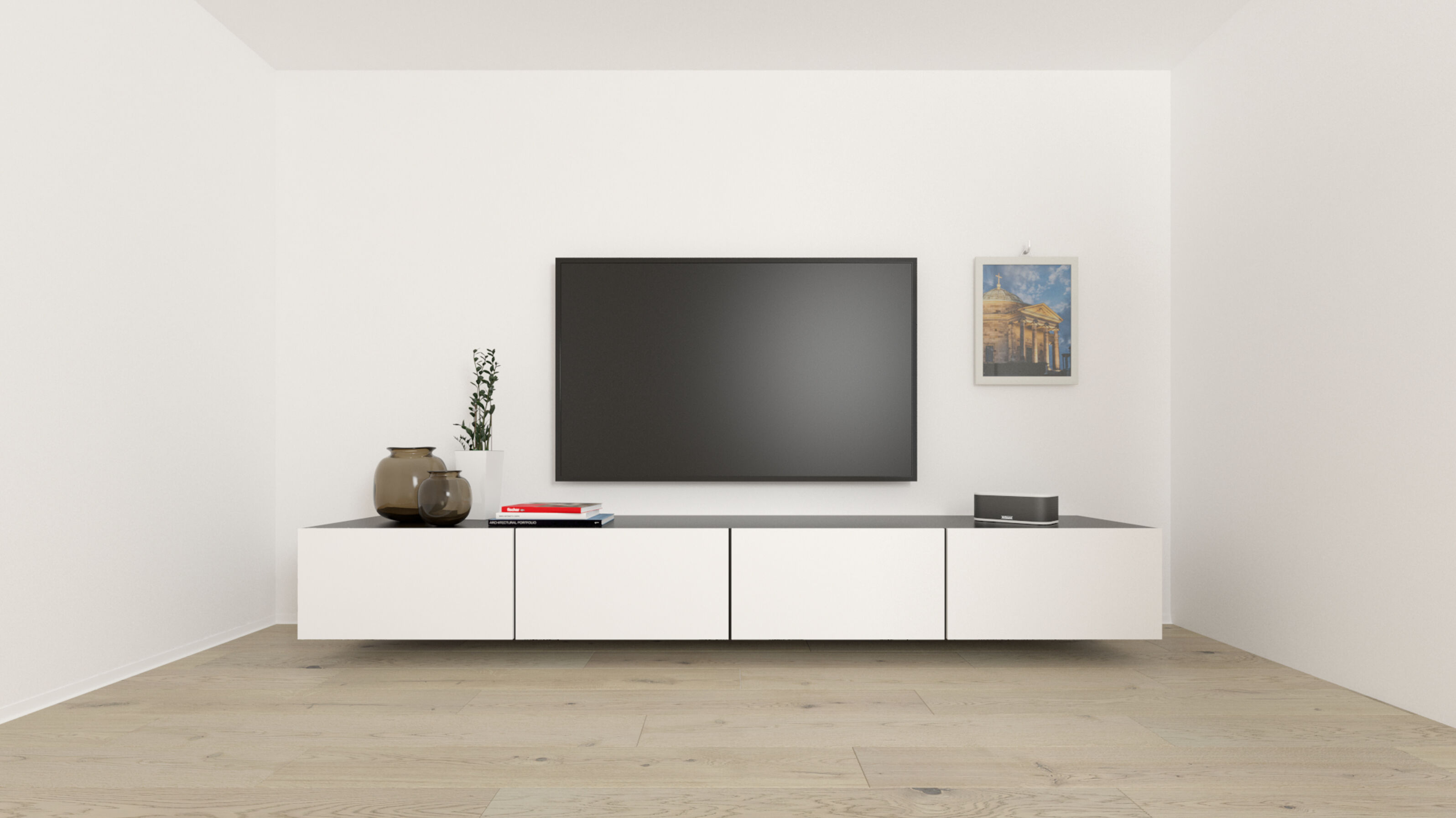 Nowoczesny salon z dużym telewizorem, białą szafką wiszącą, elementami dekoracyjnymi i drewnianą podłogą.