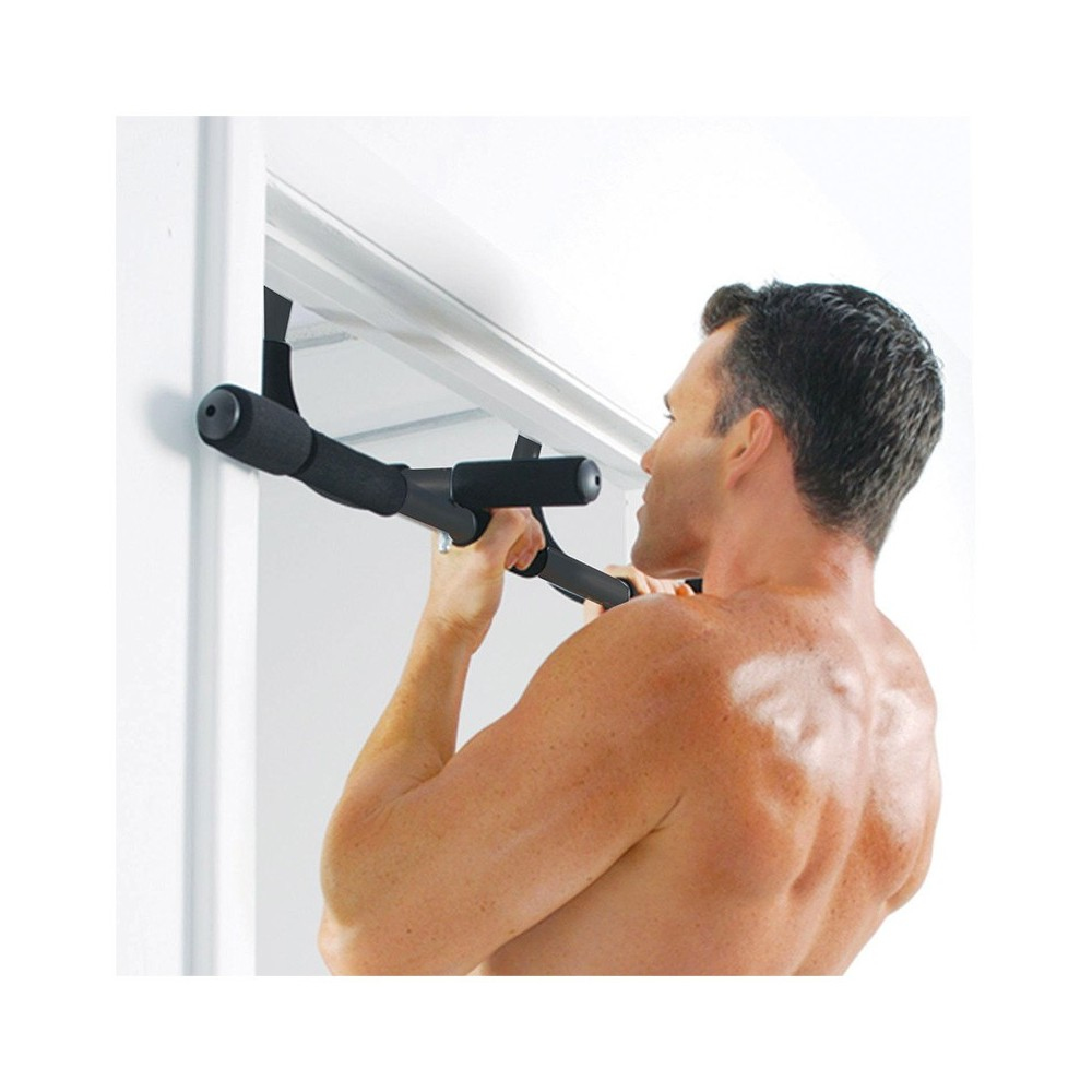 A man is doing pull-ups on a black bar attached to a doorway.