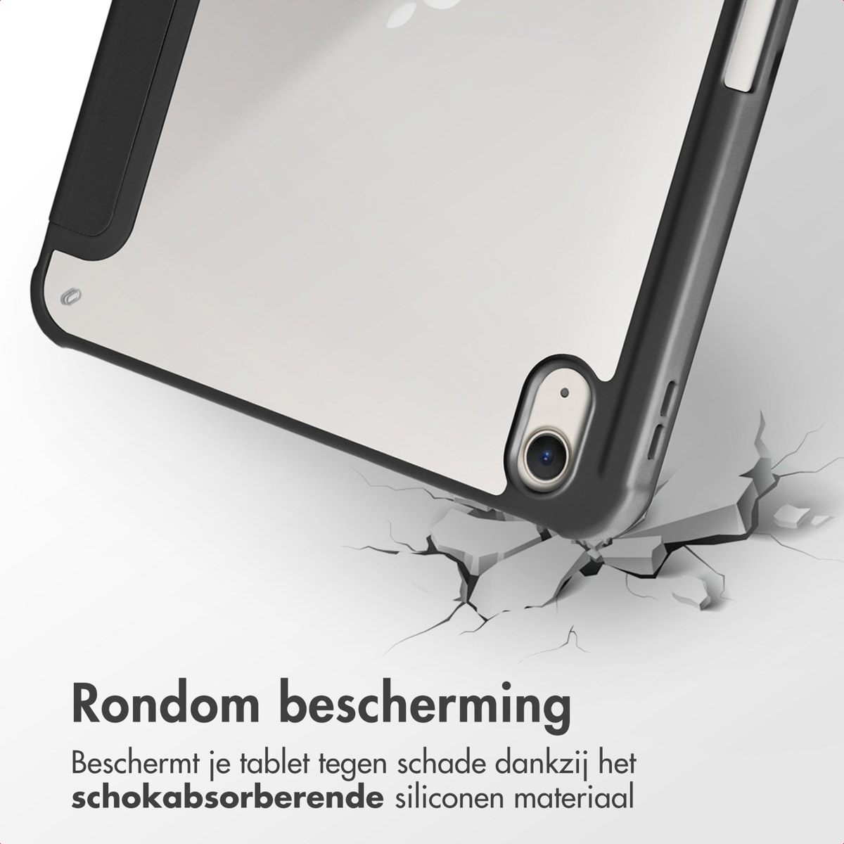 Tablet in a black protective case. It is sitting on a cracked surface.