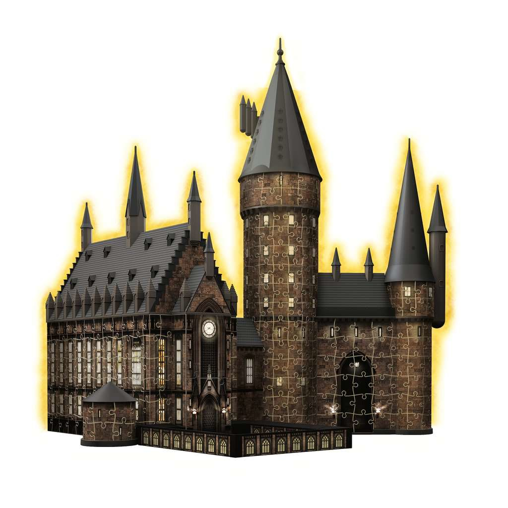 Puzzle del castello di Hogwarts, edificio in mattoni scuri con torri e finestre illuminate.