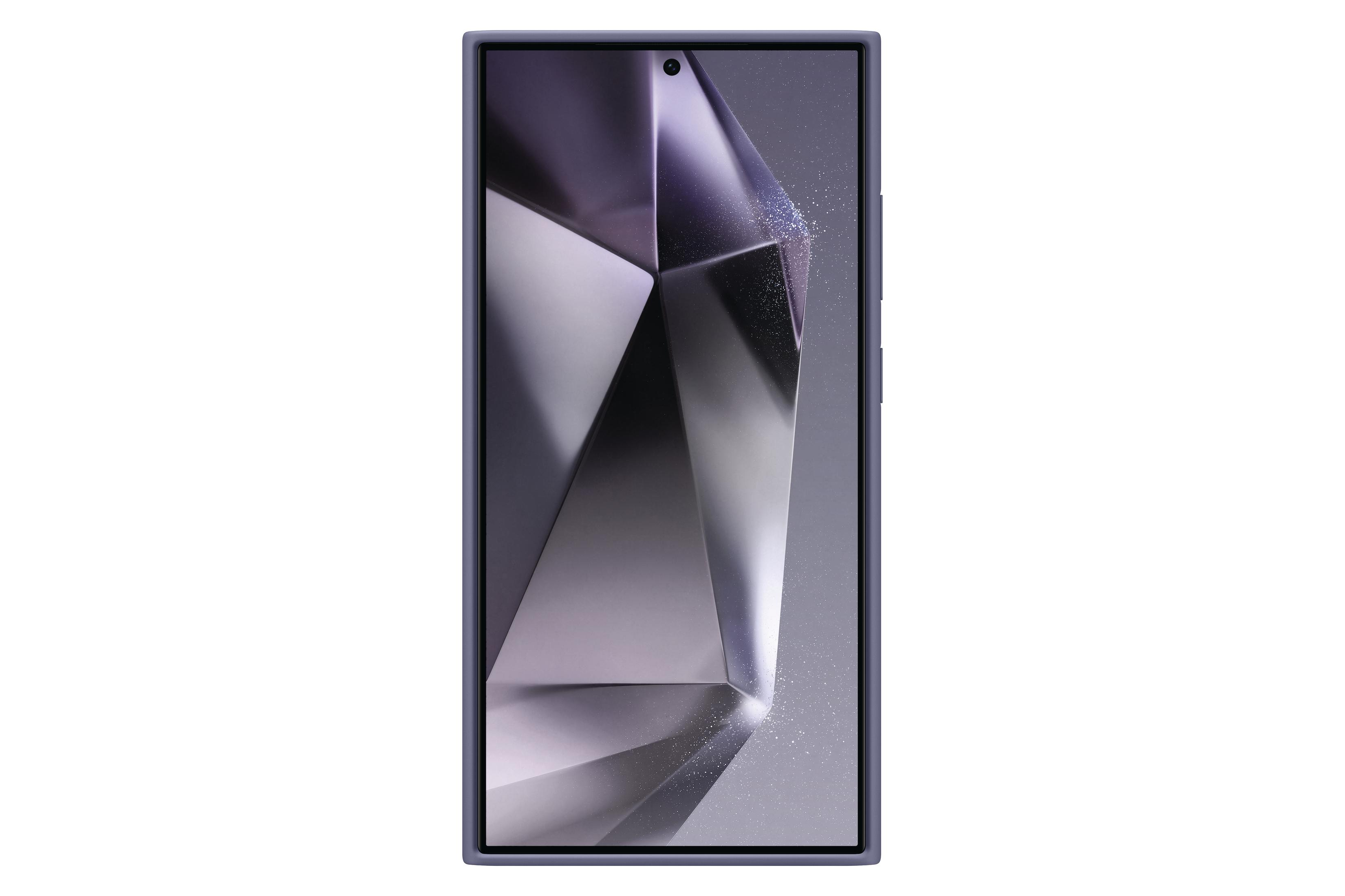 Czarny telefon z ekranem wyświetlającym abstrakcyjny wzór. Telefon jest w szarej obudowie ochronnej.