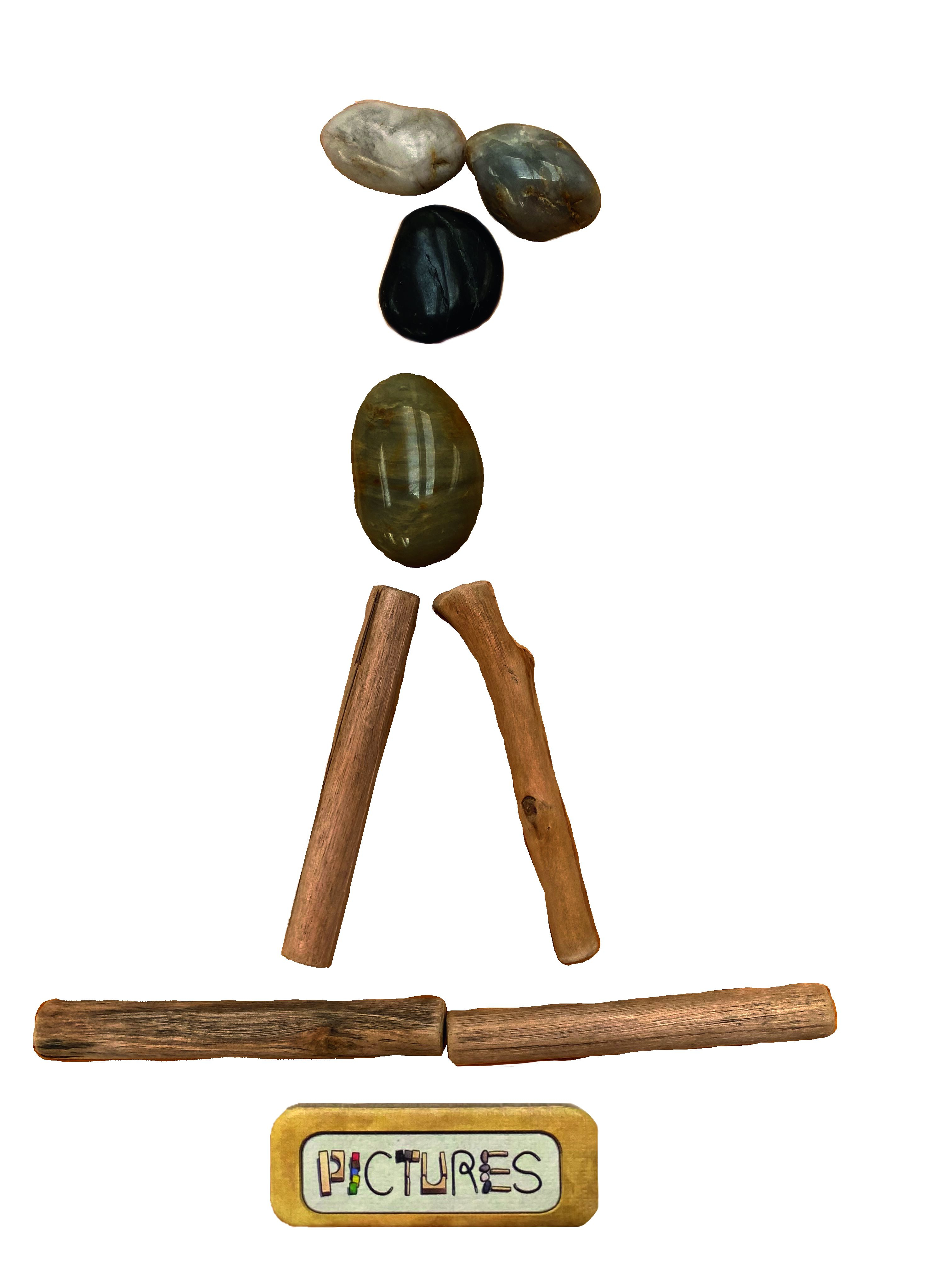 Eine künstlerische Anordnung von Steinen und Stöcken, die eine menschliche Figur darstellen.