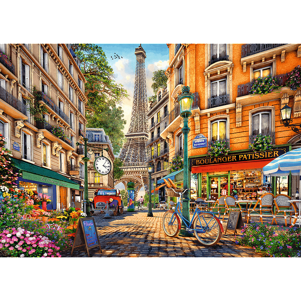 Scena di strada parigina con la Torre Eiffel, edifici, caffè e una bicicletta.
