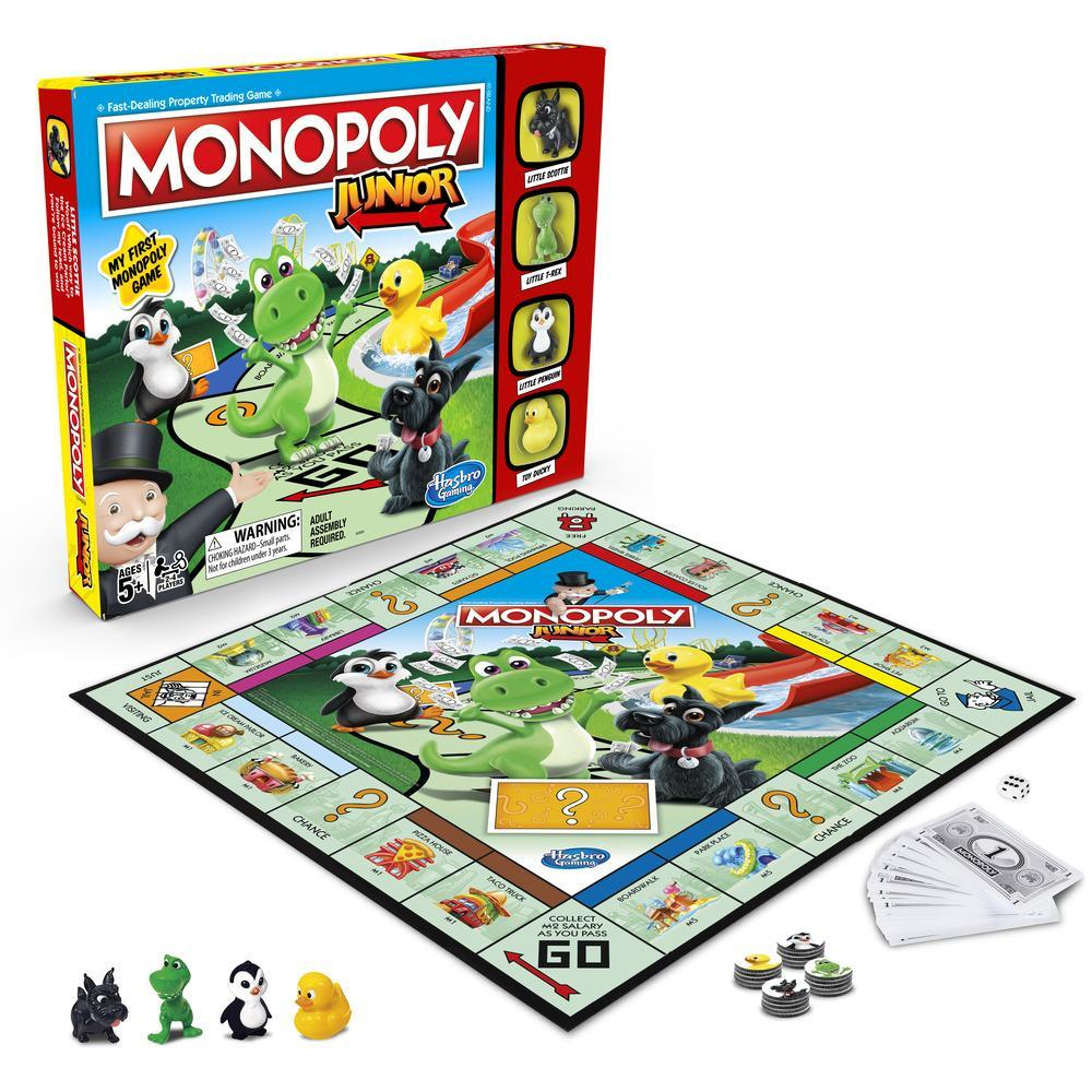 Juego de mesa Monopoly Junior. La caja muestra las piezas, el tablero y los componentes. Los personajes son un pingüino, un pato y un dinosaurio.