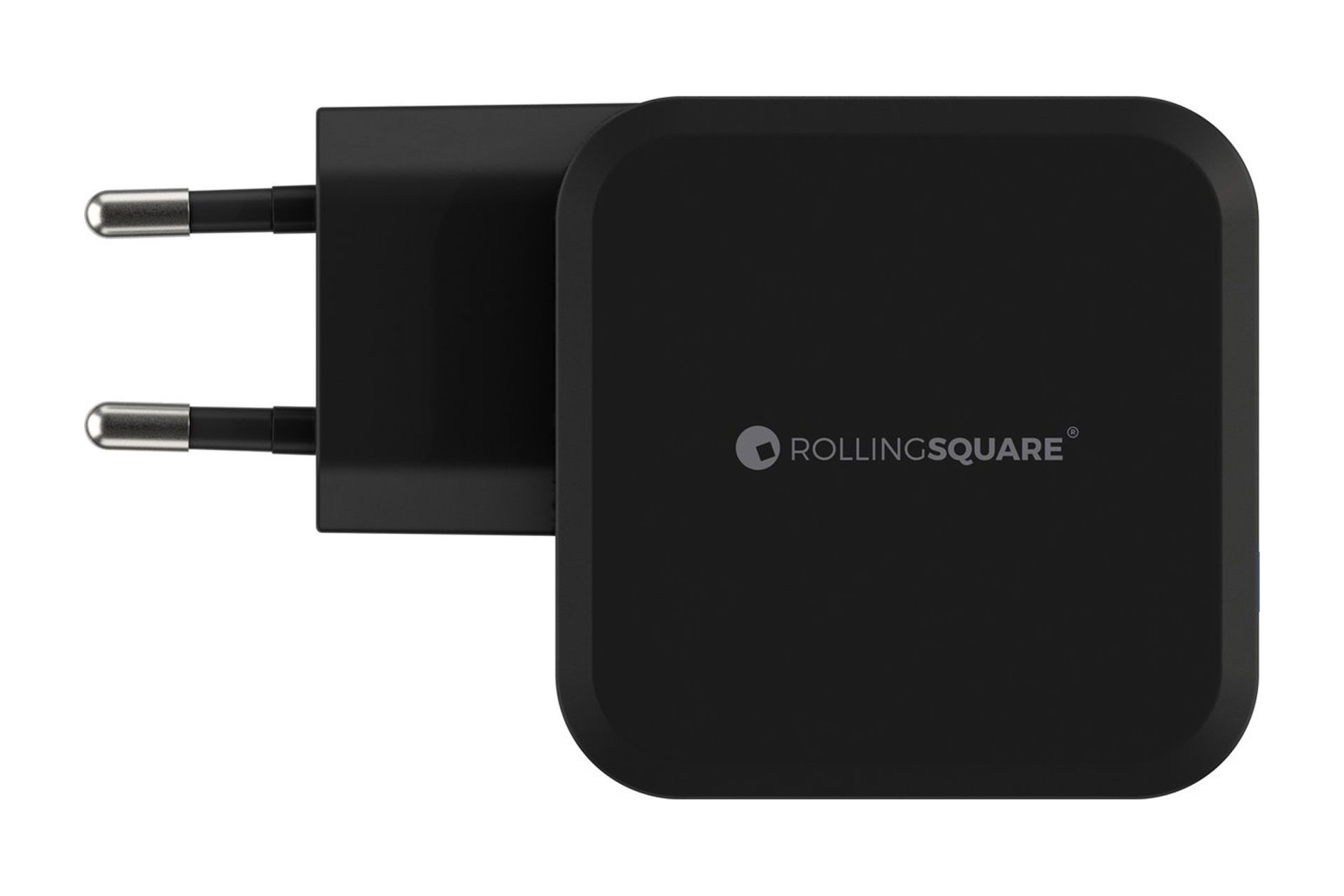 Een zwarte Rolling Square oplaadadapter. Het is een vierkante adapter met twee pinnen.
