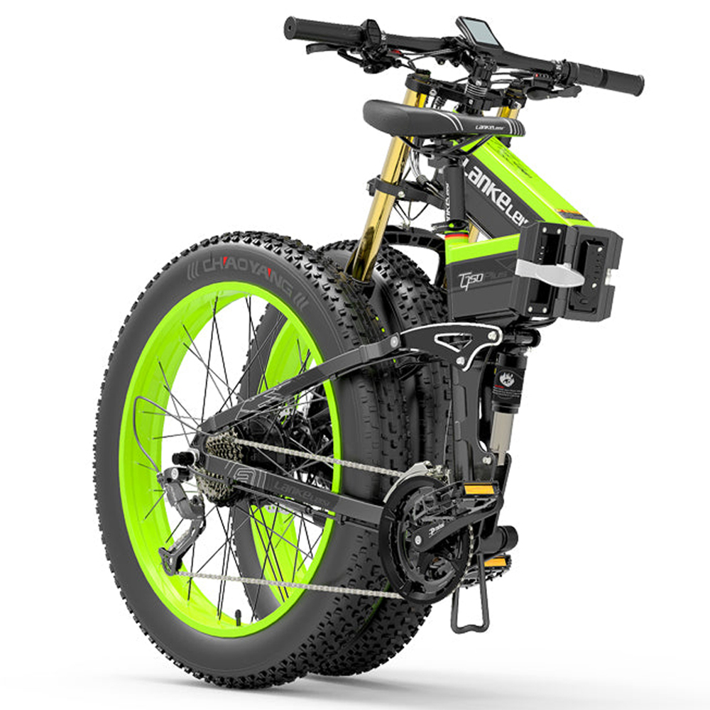 Se muestra una bicicleta eléctrica verde y negra con un neumático delantero grande. La bicicleta está sobre un fondo blanco.