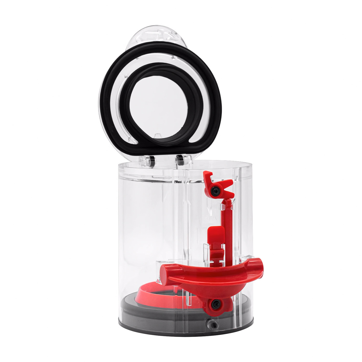 Przezroczyste plastikowe urządzenie z czerwonymi elementami. Czarny pierścień i elementy wewnętrzne. Otwarta pokrywa.