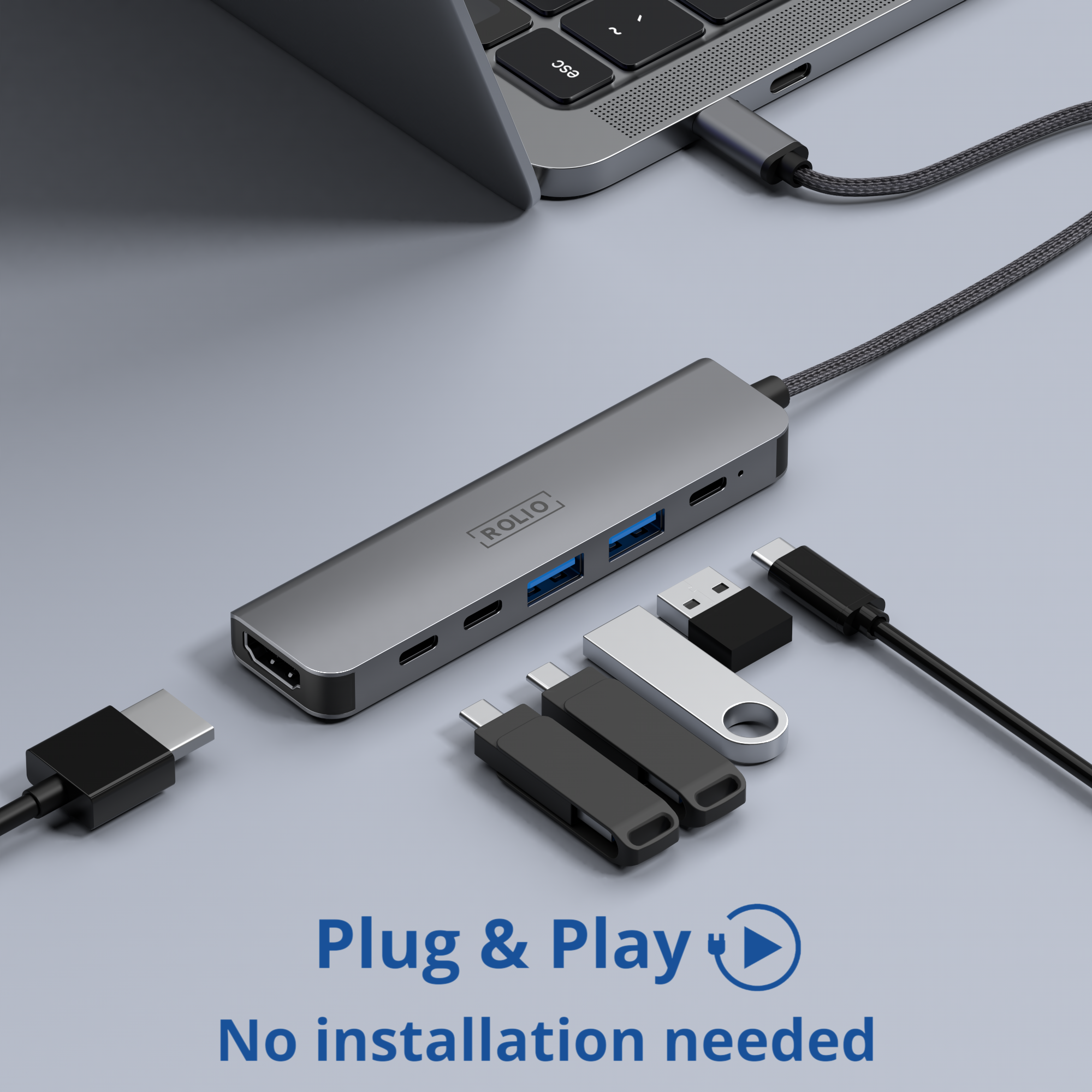 Ein silberner Hub mit USB-Anschlüssen, verbunden mit einem Laptop und anderen USB-Geräten.