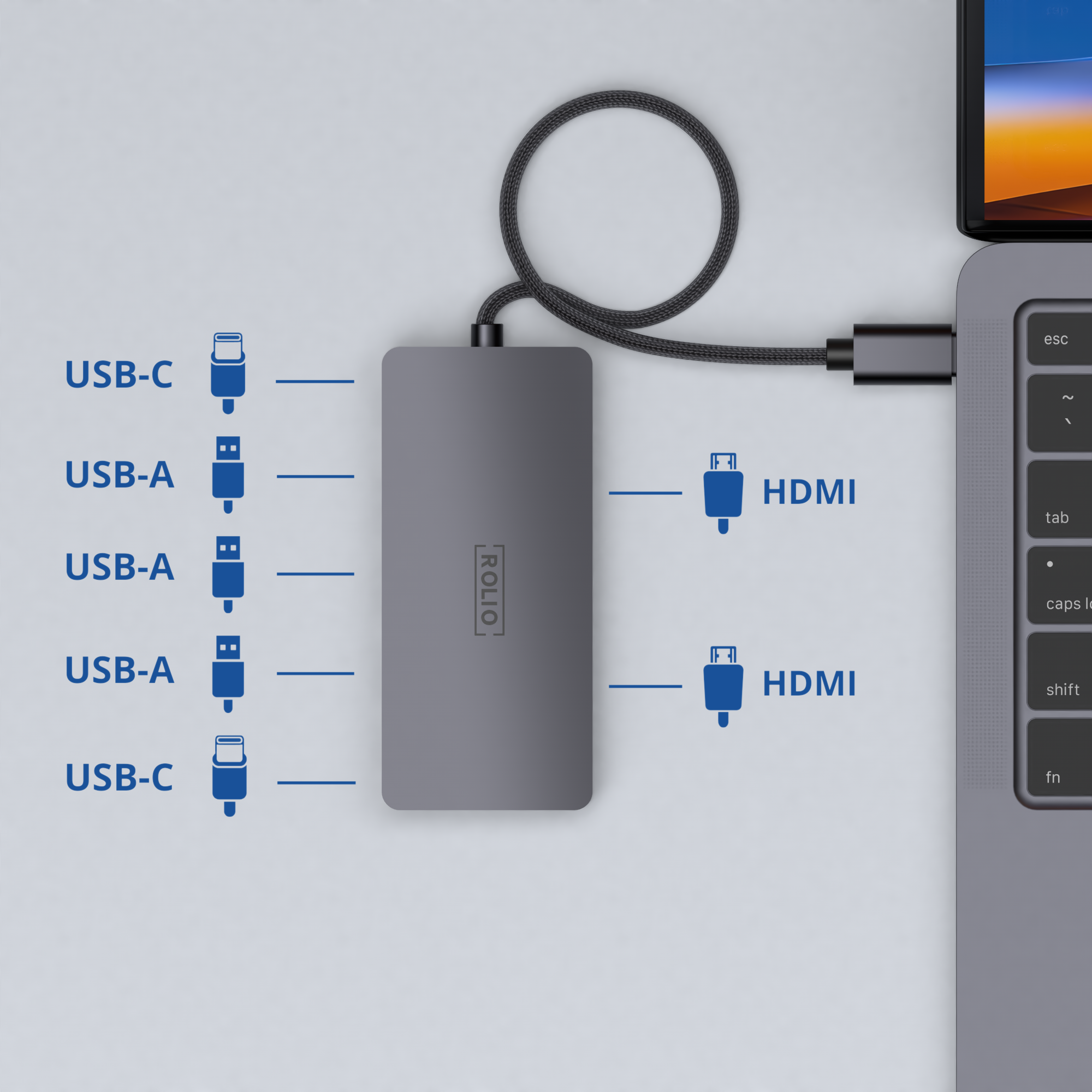 A hub with USB and HDMI ports connected to a laptop.