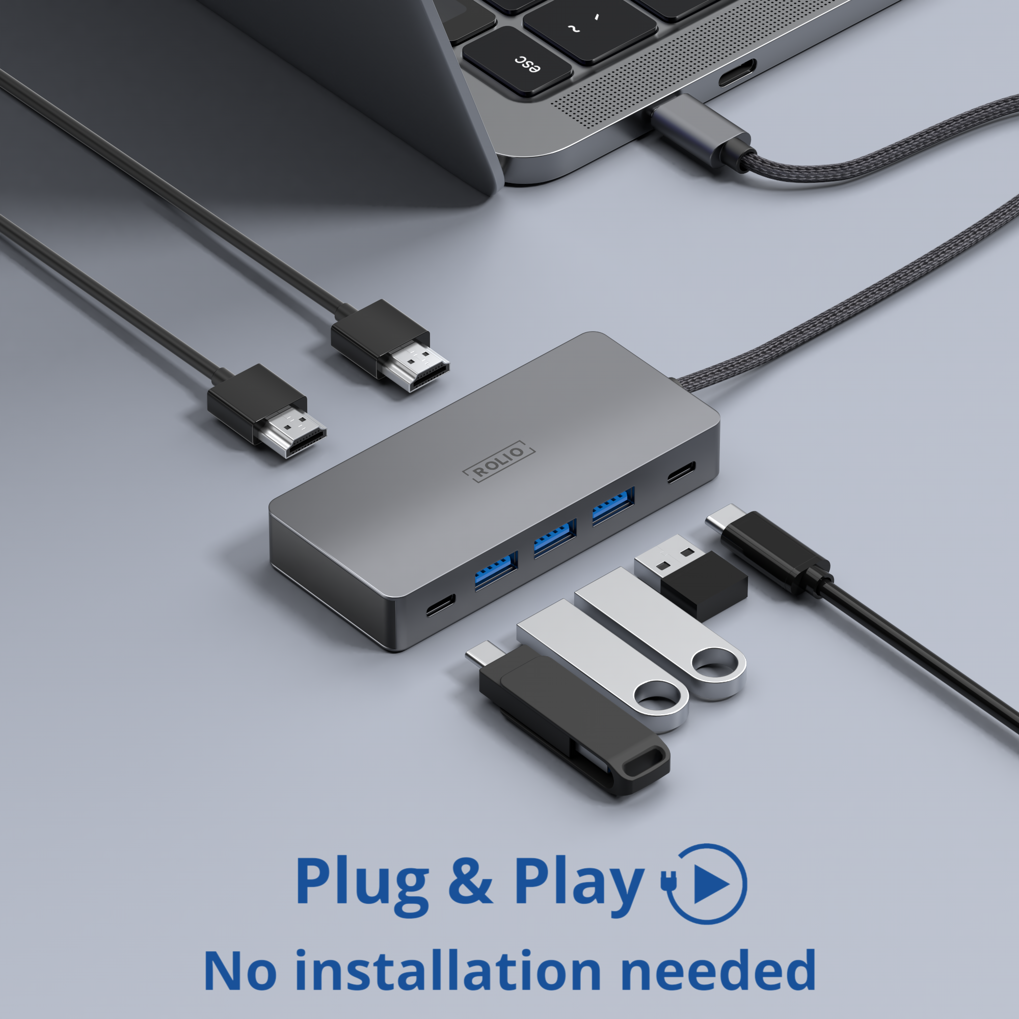A grey hub with USB ports and USB drives connected. Plug and play text below.