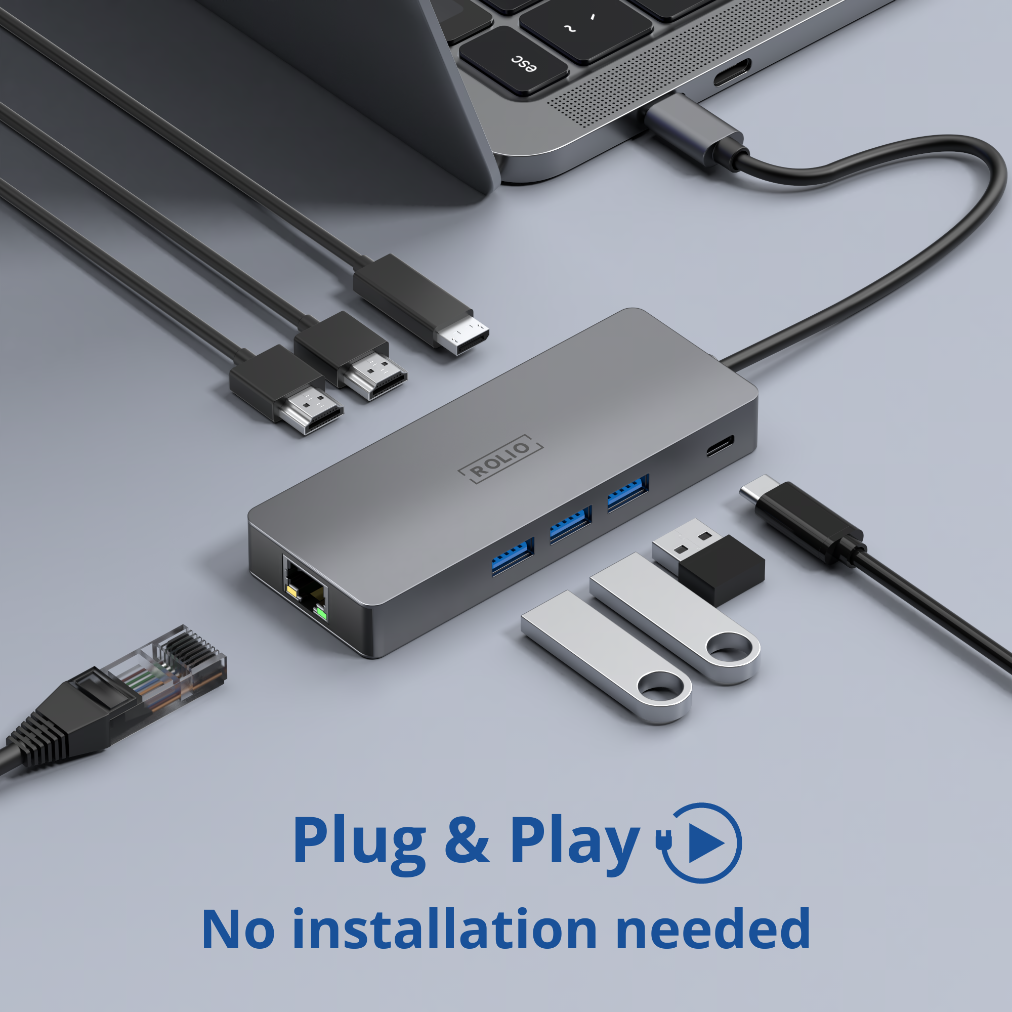 Un hub de couleur argent avec plusieurs ports, des clés USB et des câbles.