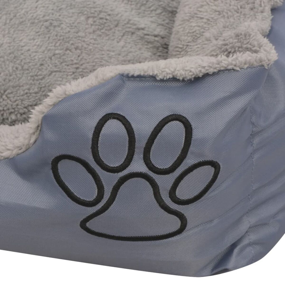 Blaues Haustierbett mit Pfotenabdruck. Das Bett hat flauschige graue Seiten und einen grauen Stoffinnenraum.
