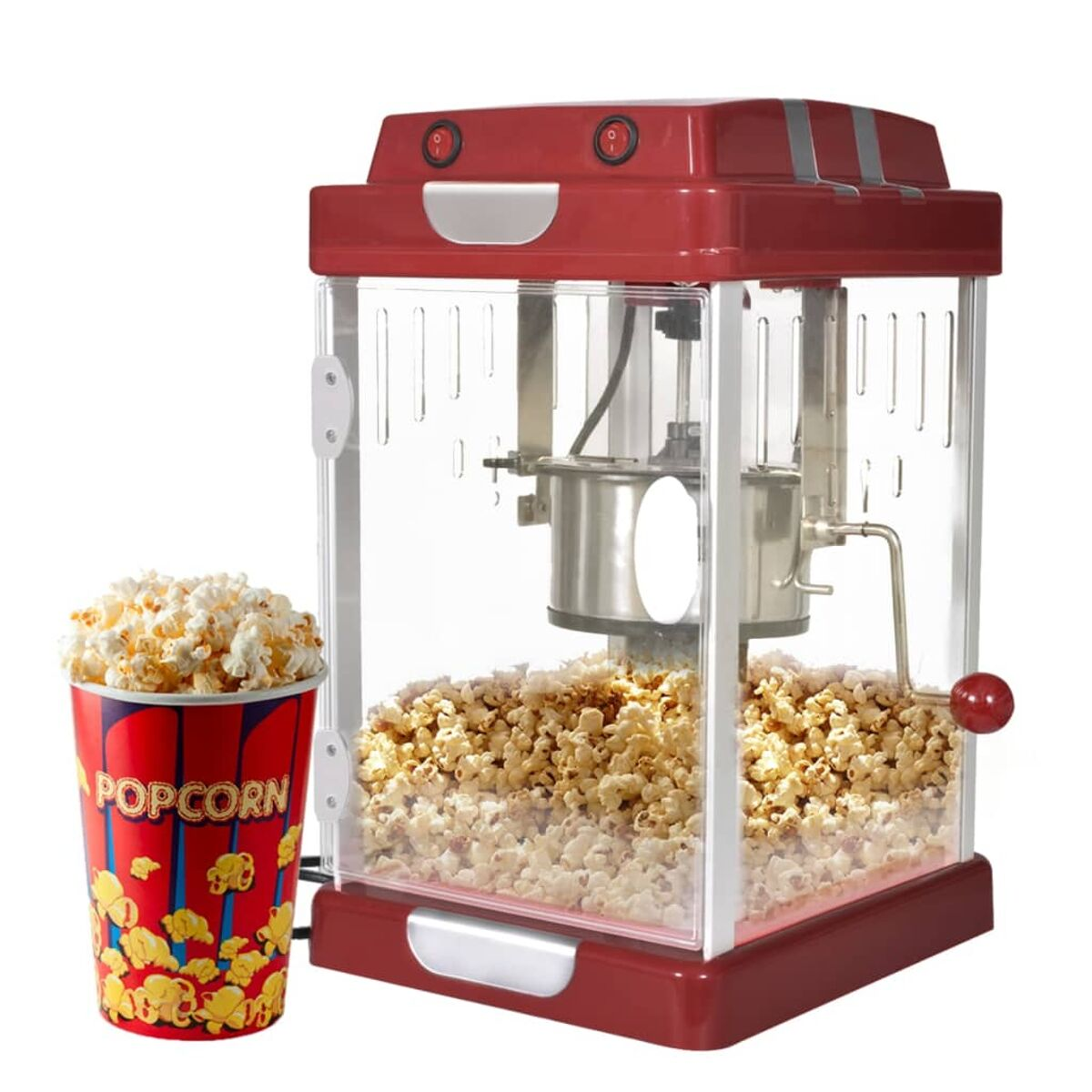 Rote Popcornmaschine mit Popcorn darin und eine Tasse Popcorn links.