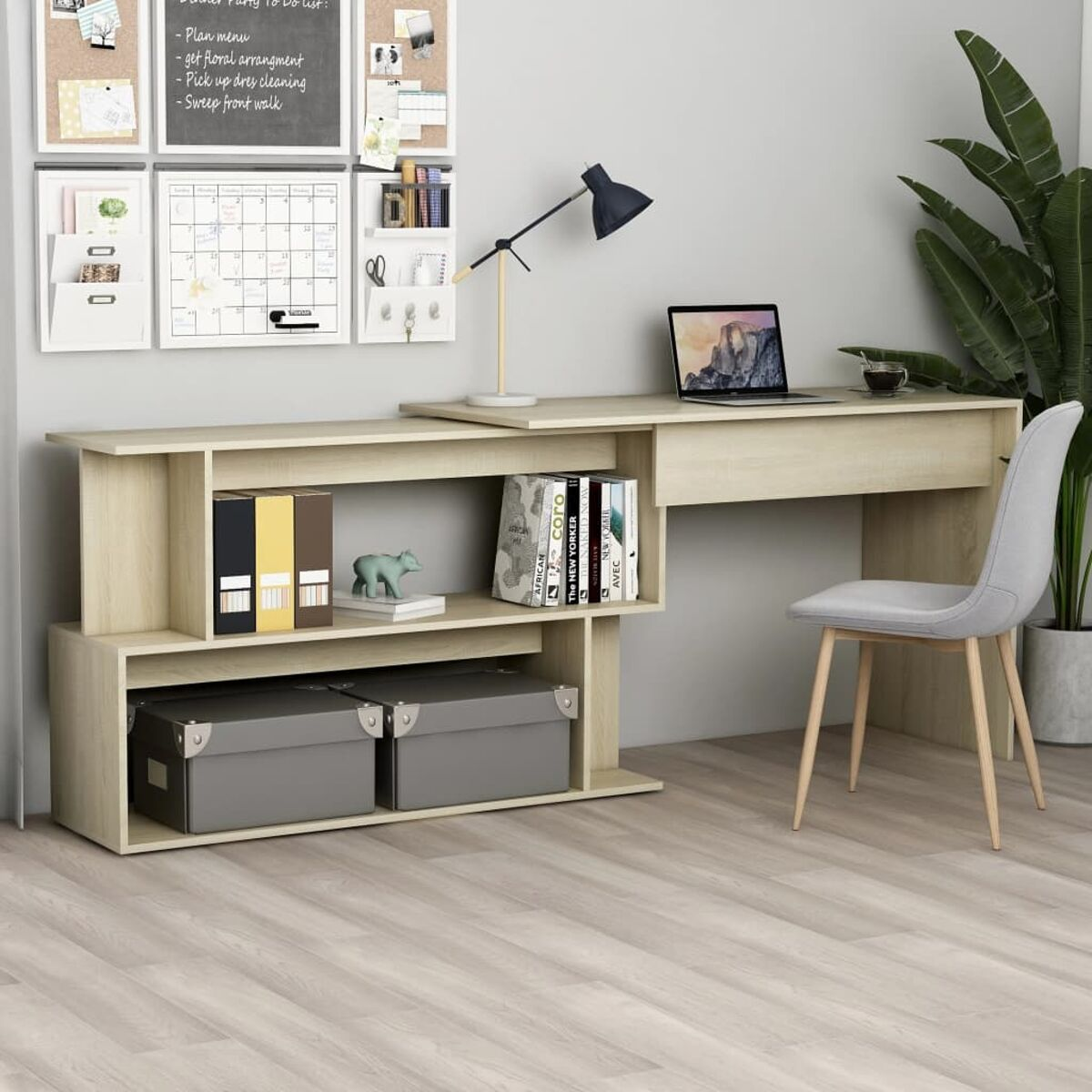 Beiger Schreibtisch mit Laptop, Büchern und anderen Gegenständen oben drauf.