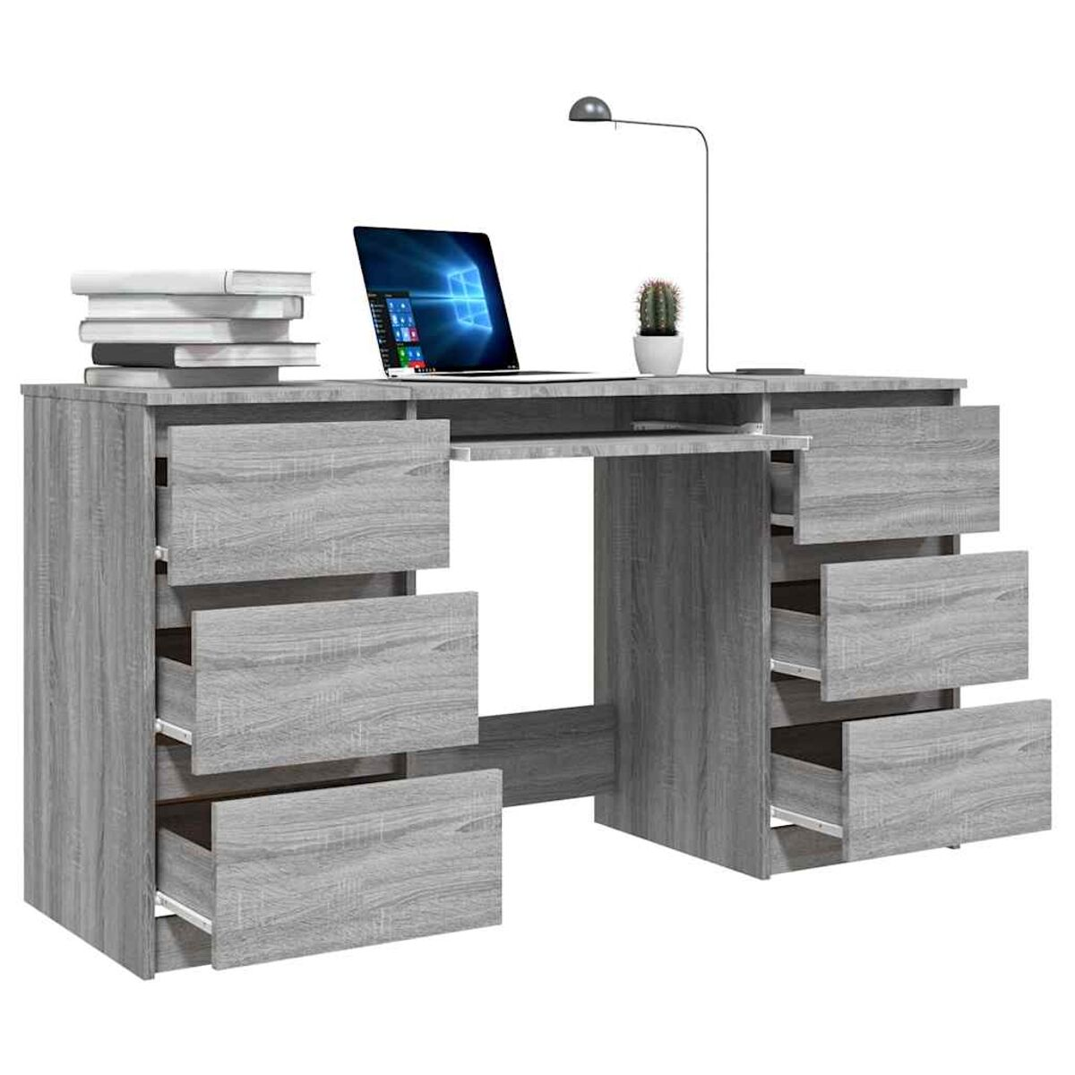 Grauer Schreibtisch mit Schubladen, Büchern, Laptop und Lampe. Der Laptop zeigt Windows an.
