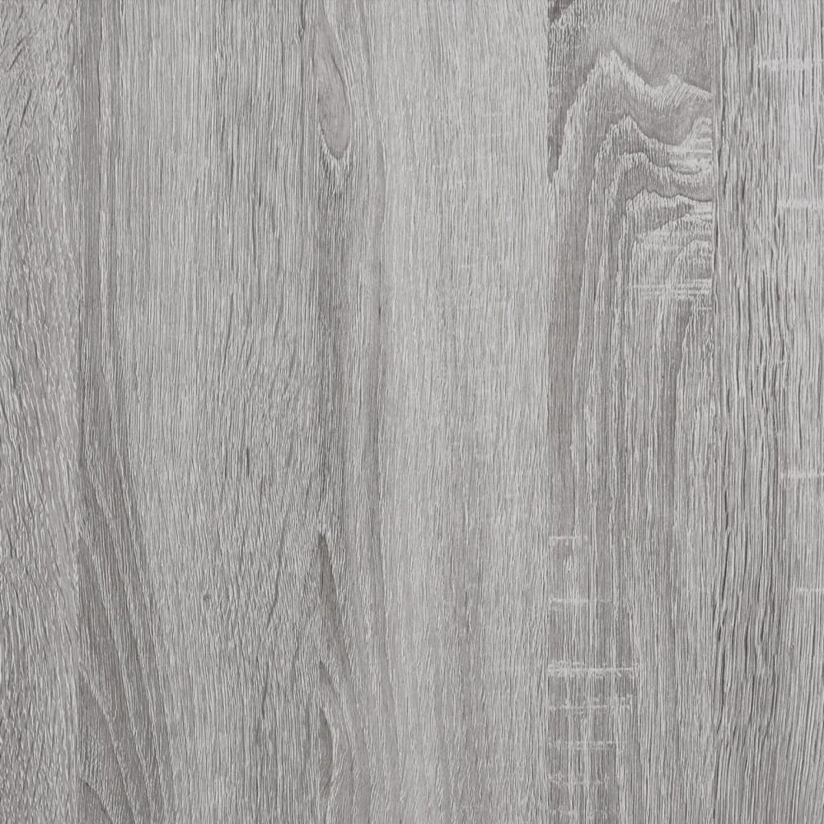 Nahaufnahme von grauen Holzplanken mit sichtbarer Holzmaserung.