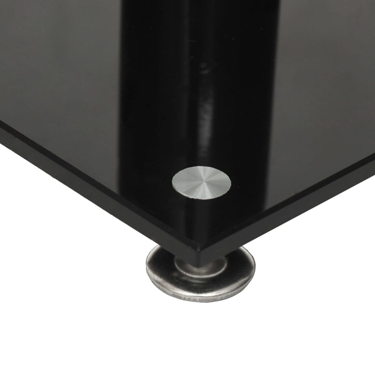 Ecke eines schwarzen, glänzenden Glastisches mit Metallstütze.