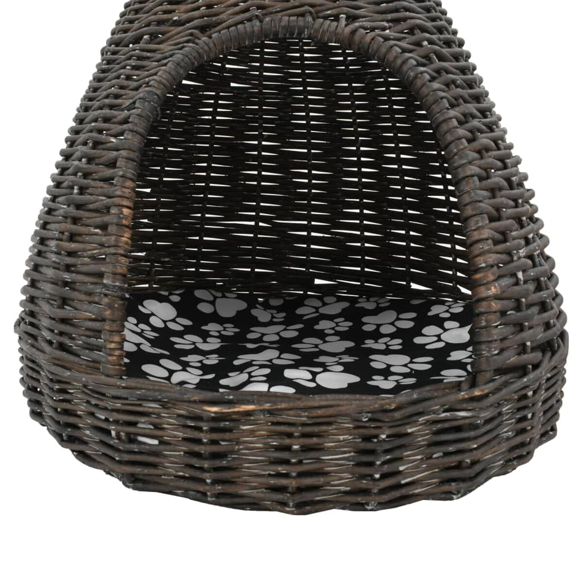 Ein Haustierbett aus Korbgeflecht mit einem schwarz-weiß Pfotenabdruck-Musterkissen im Inneren. Die Form ist oval.