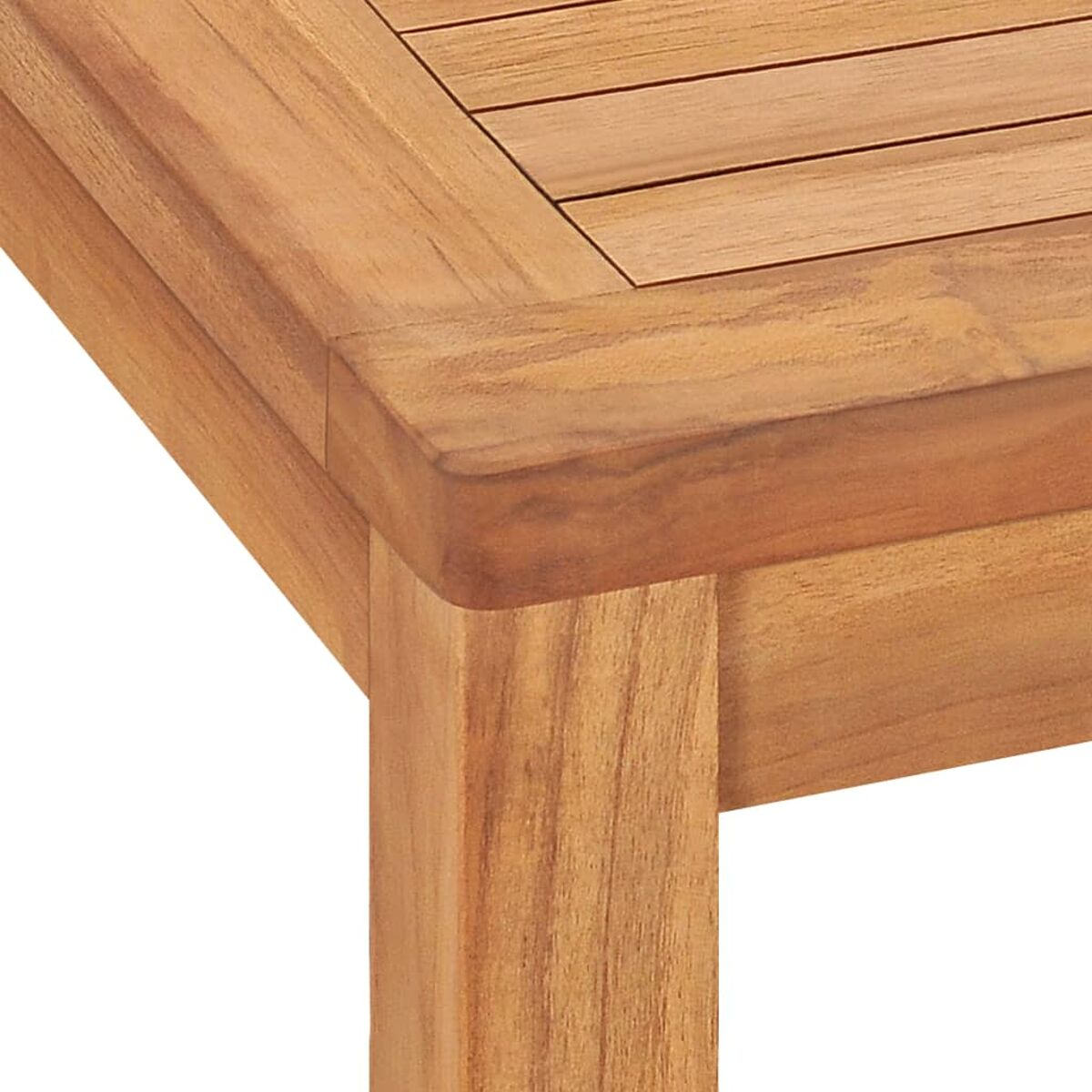 Nahaufnahme einer Holztischecke, die die Holzmaserung und Konstruktion zeigt.