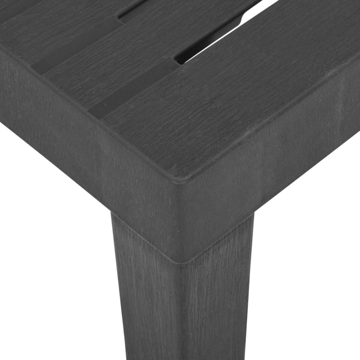 Nahaufnahme einer dunkelgrauen Holztischecke und -beins.